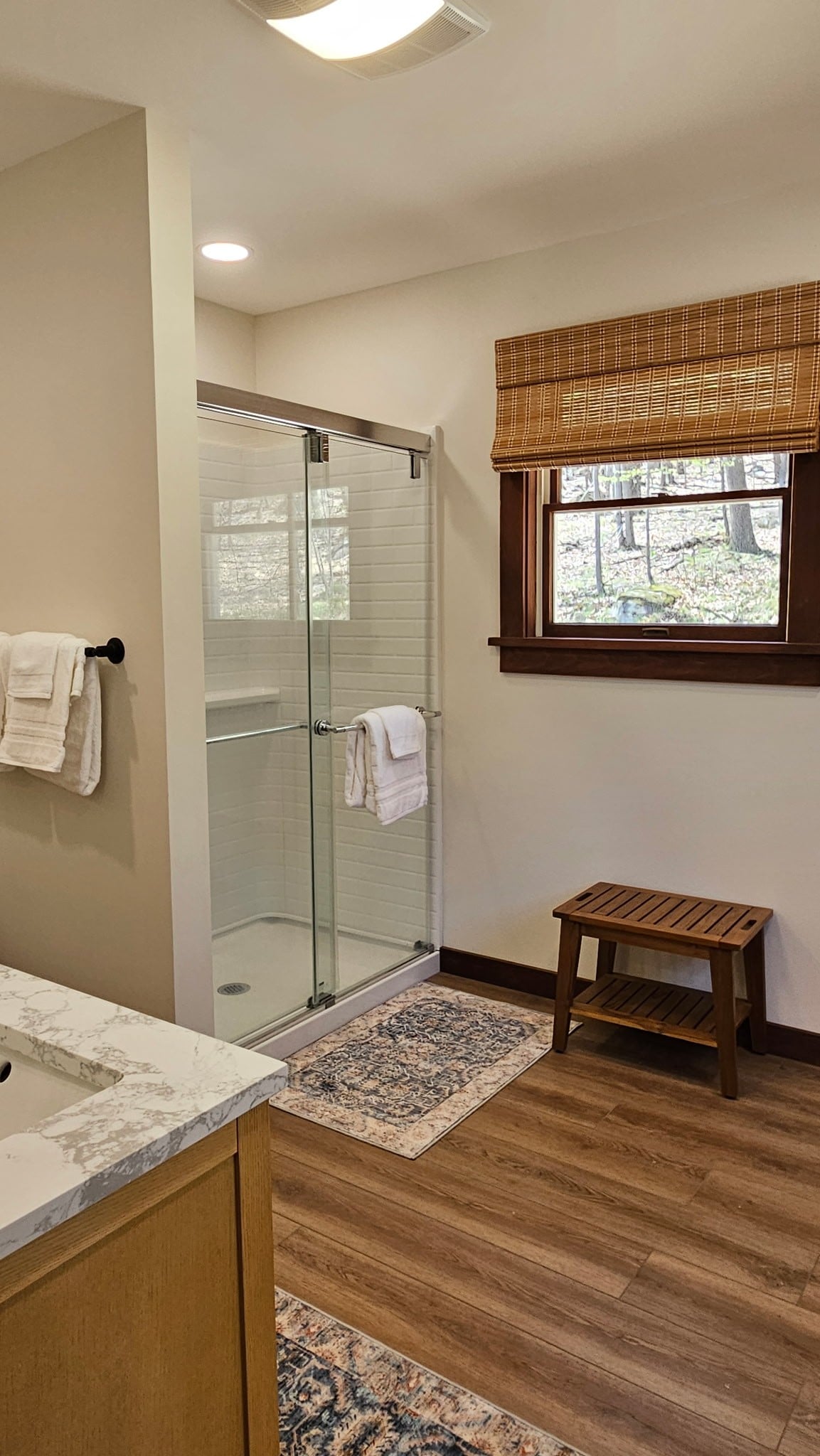 Step into the Master Bath's glass shower and take your time — there's a bench, there's hot water, and nobody's waiting.