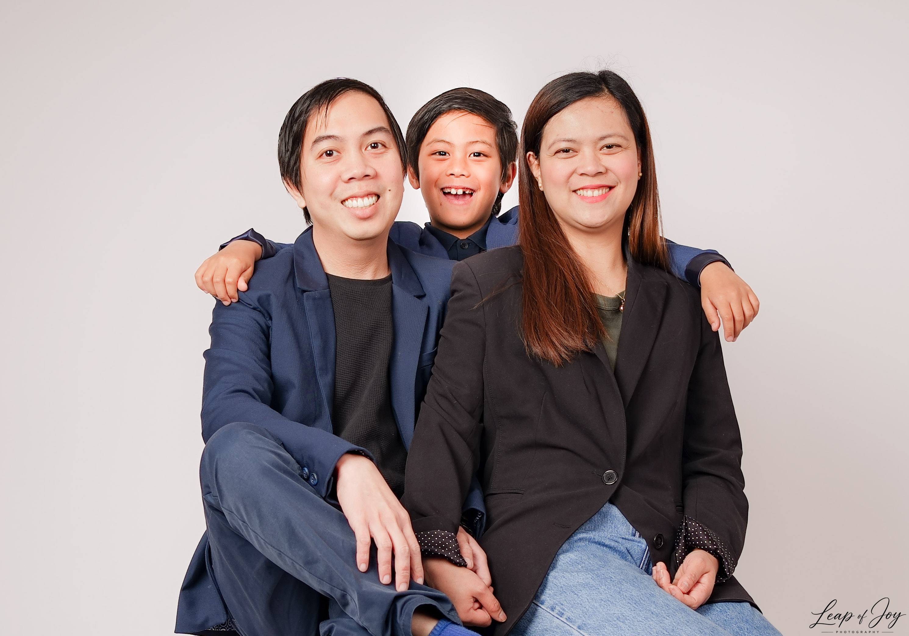 A family photographed in the Auckland studio