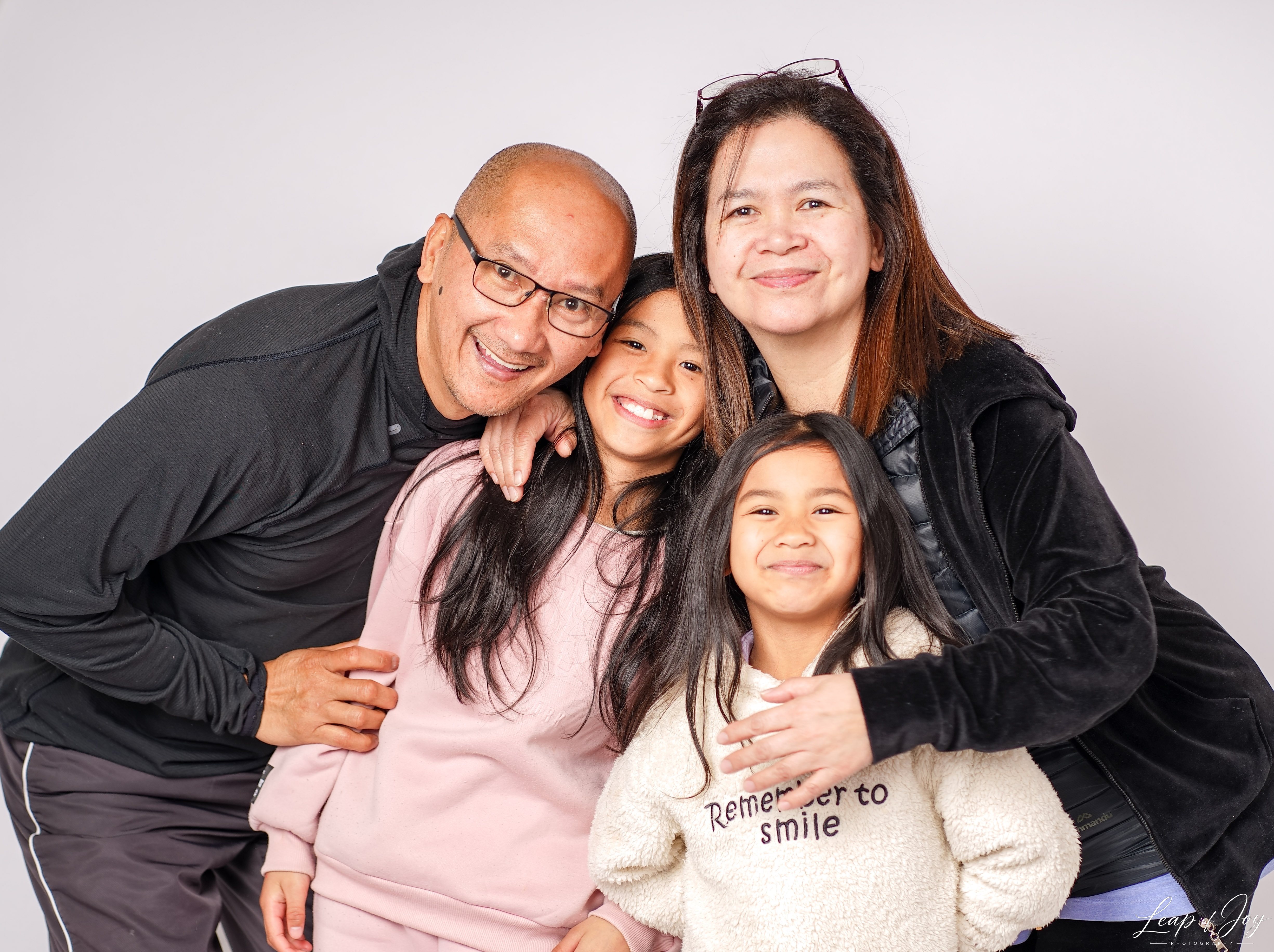 A family photographed in the Auckland studio
