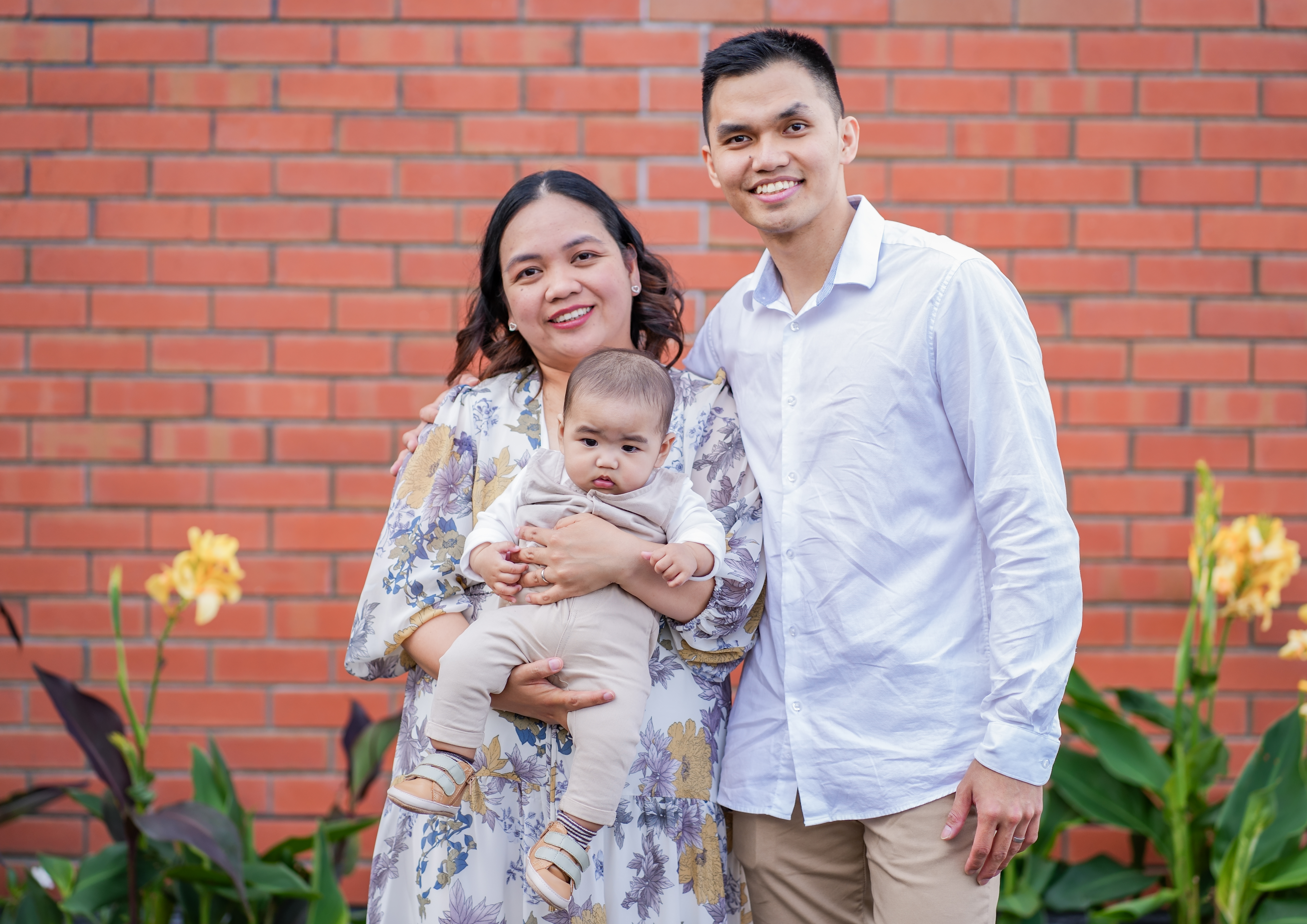 A family photographed outdoors in Auckland