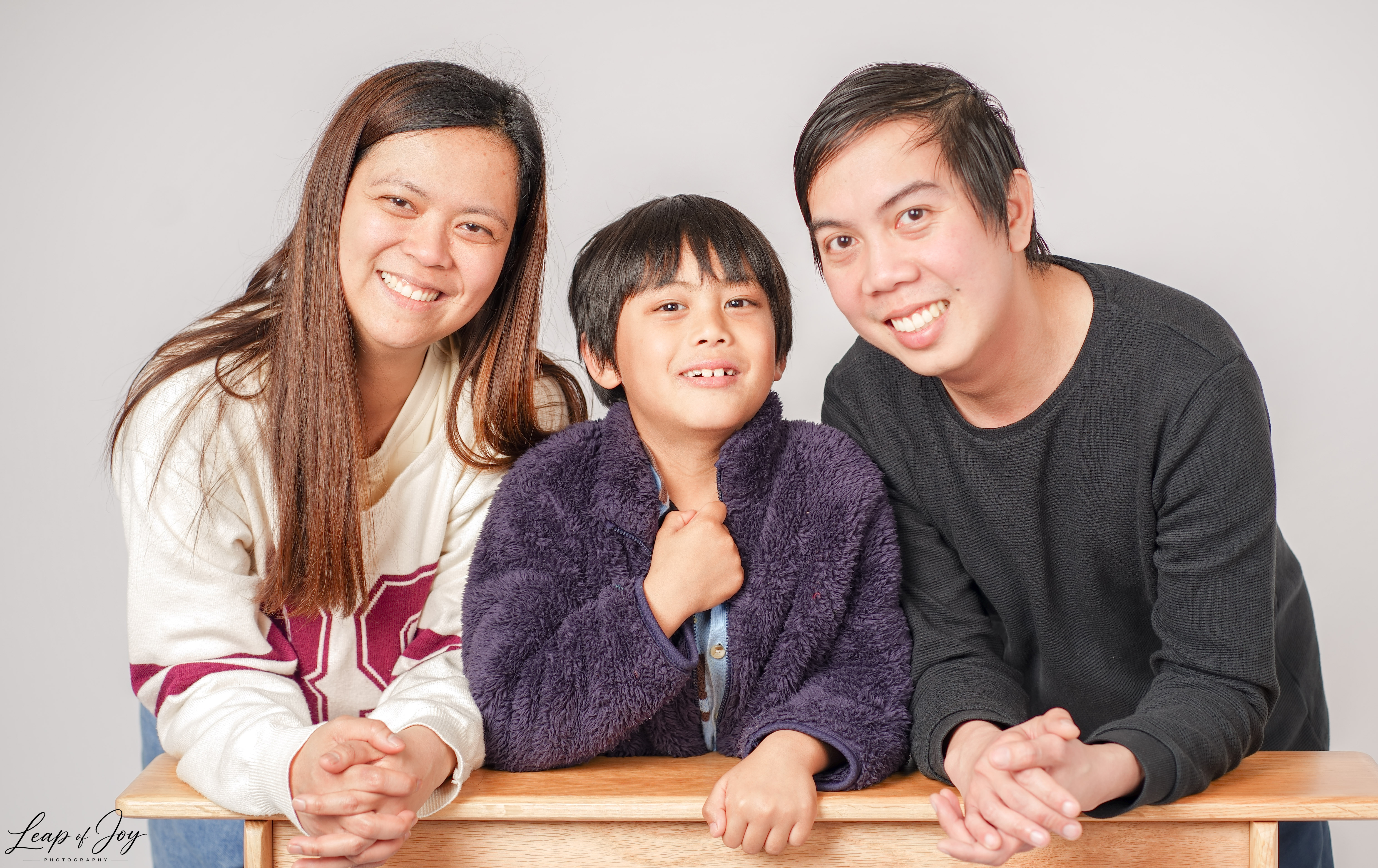 A family photographed in the Auckland studio
