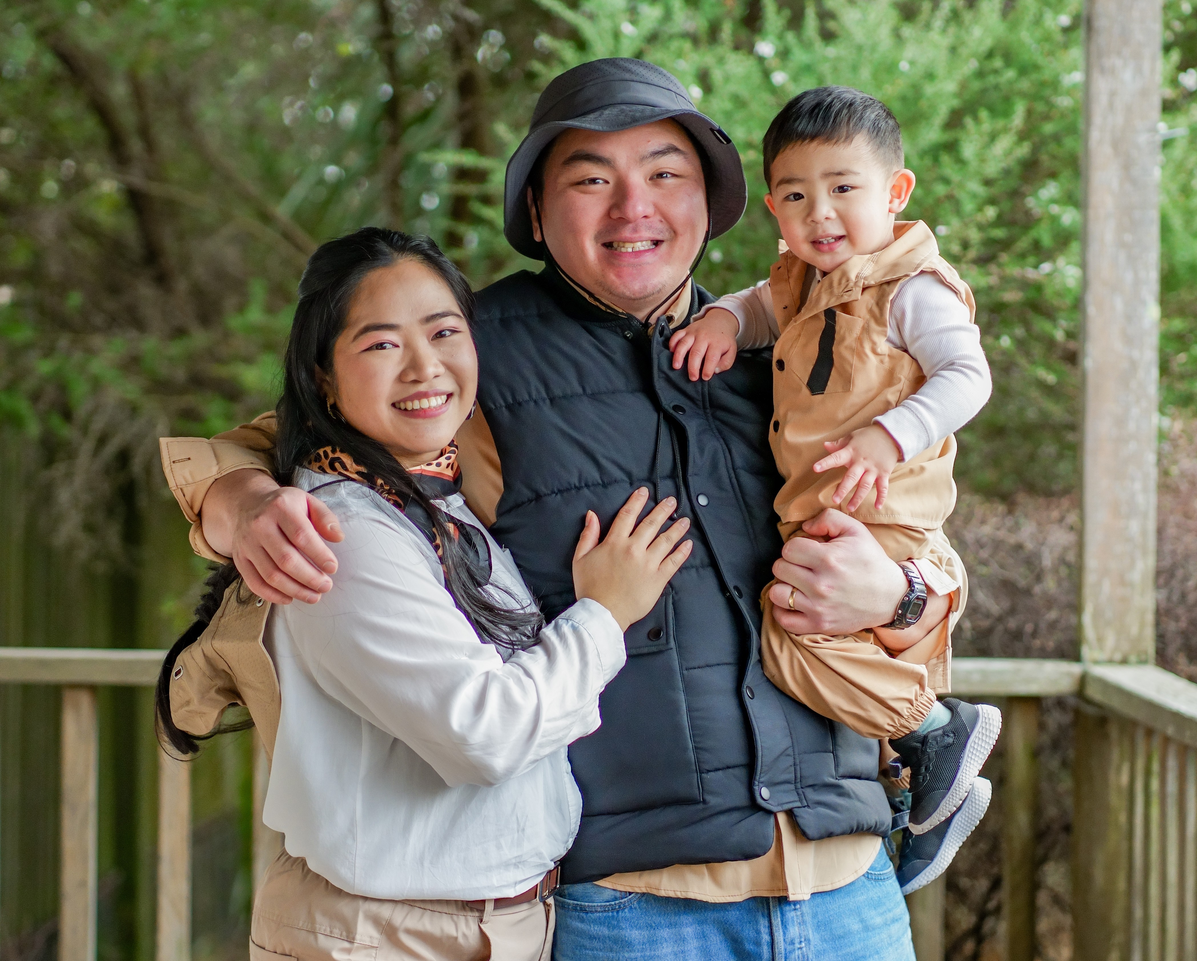 A family photographed outdoors in Auckland