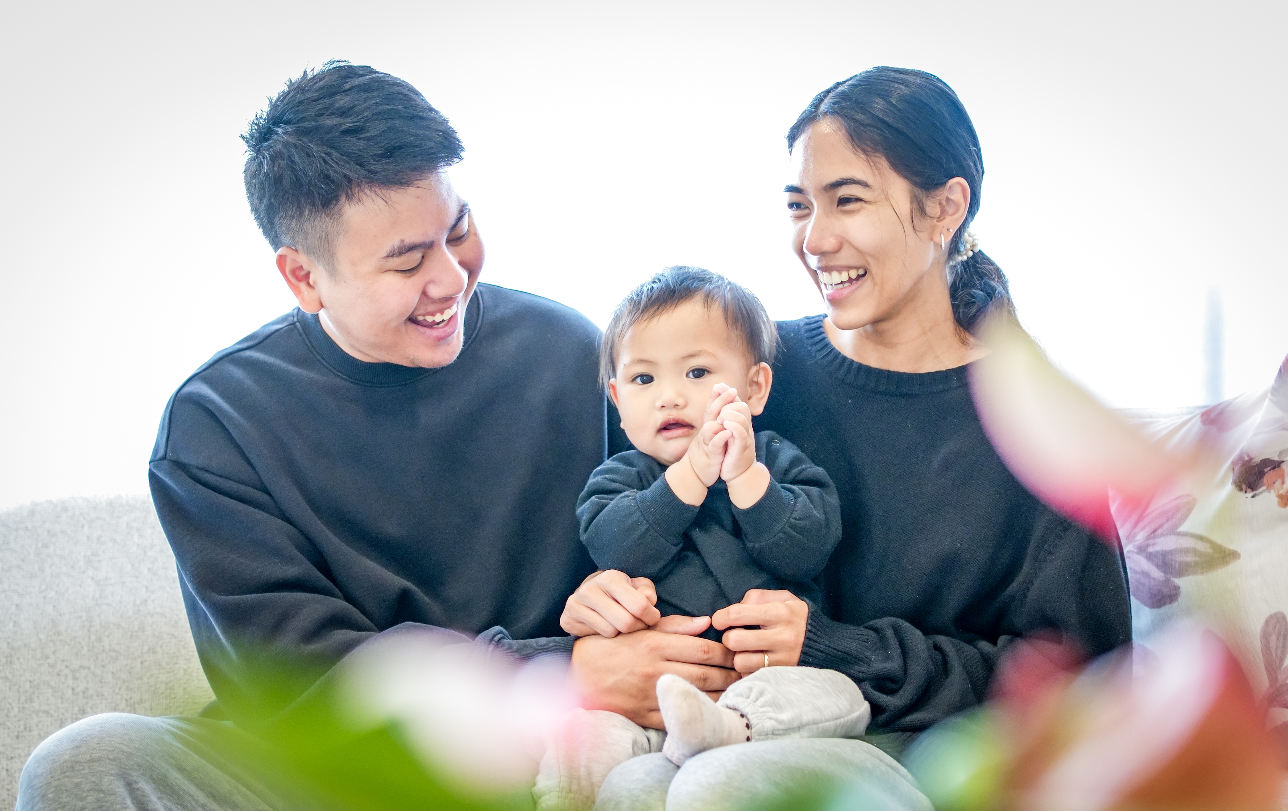 A family photographed outdoors in Auckland