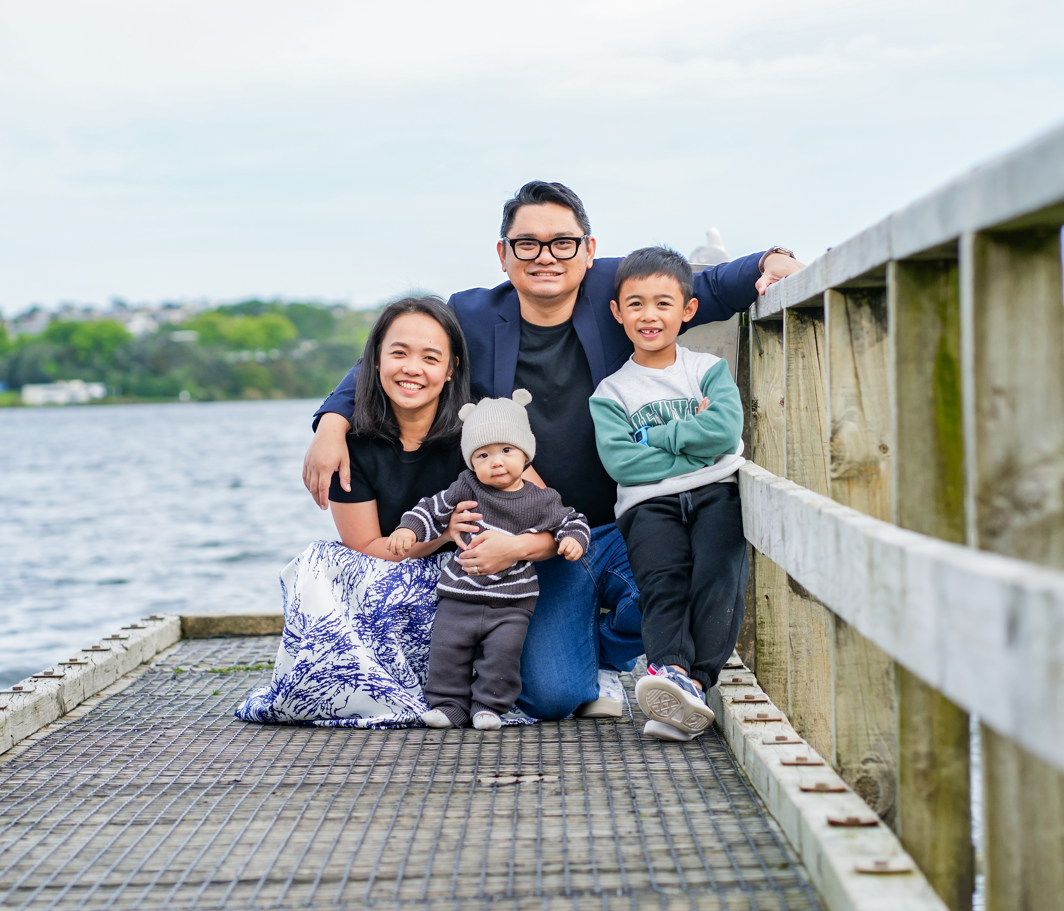 A family photographed outdoors in Auckland