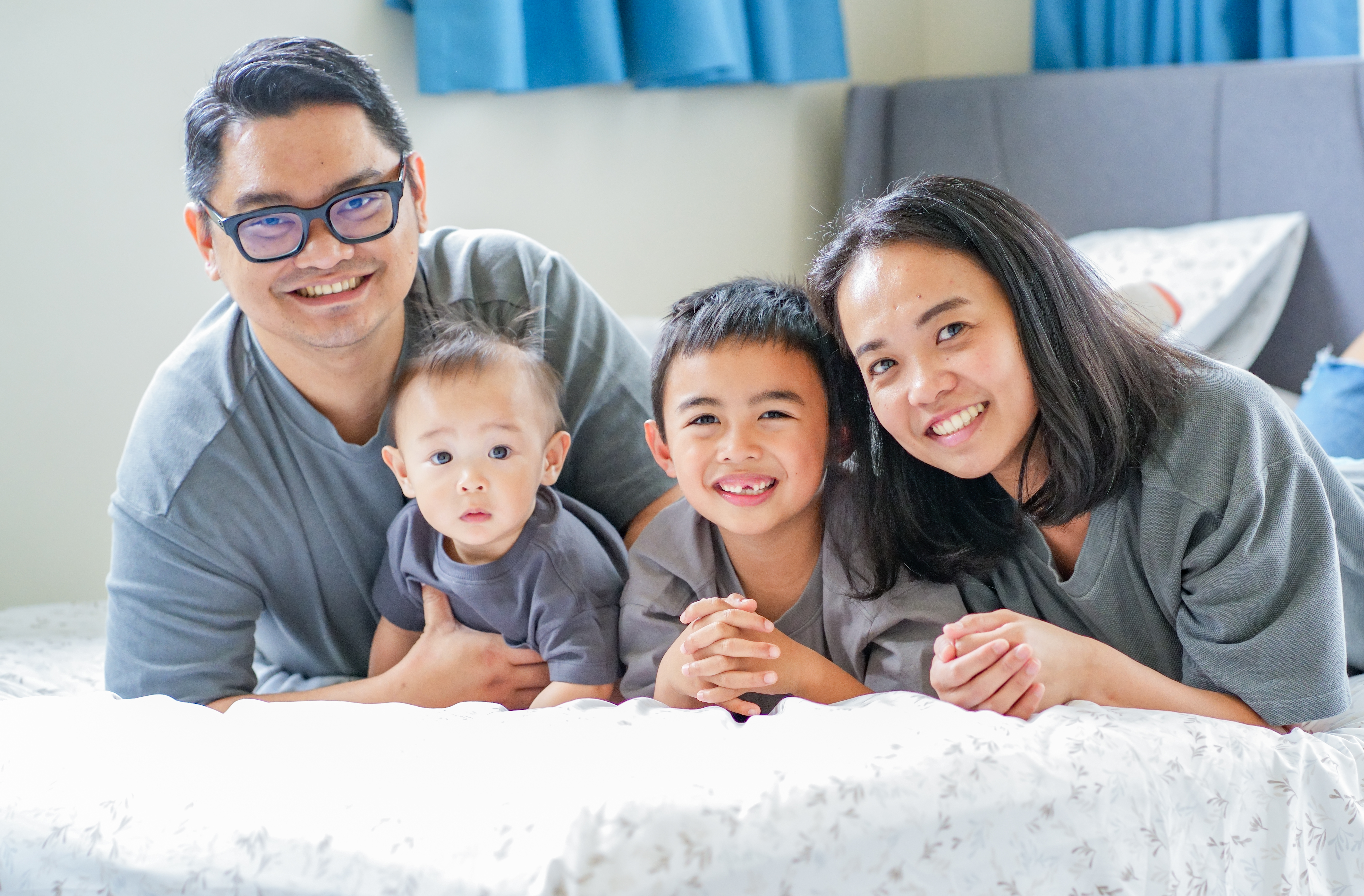 A family photographed outdoors in Auckland
