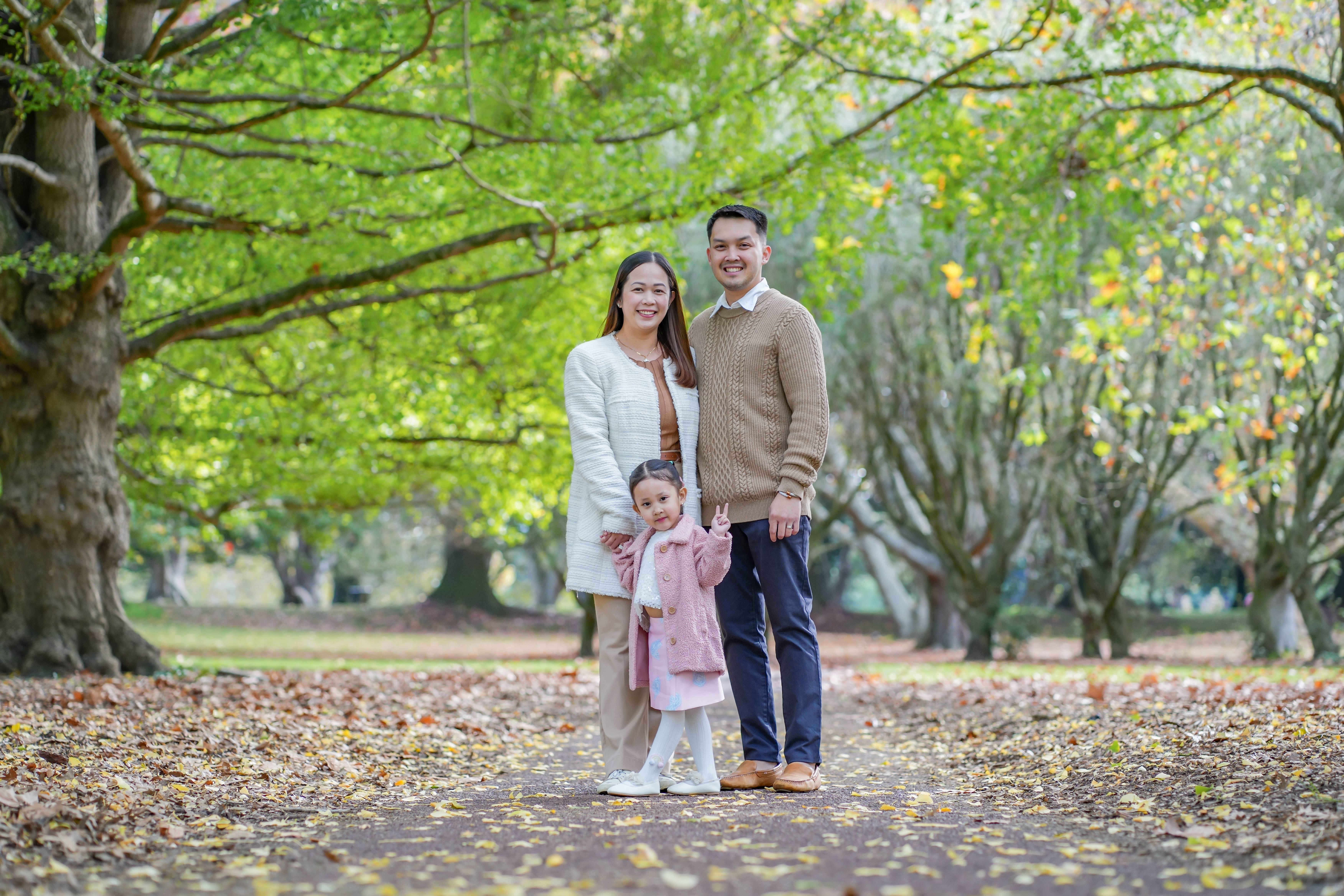 A family photographed outdoors in Auckland