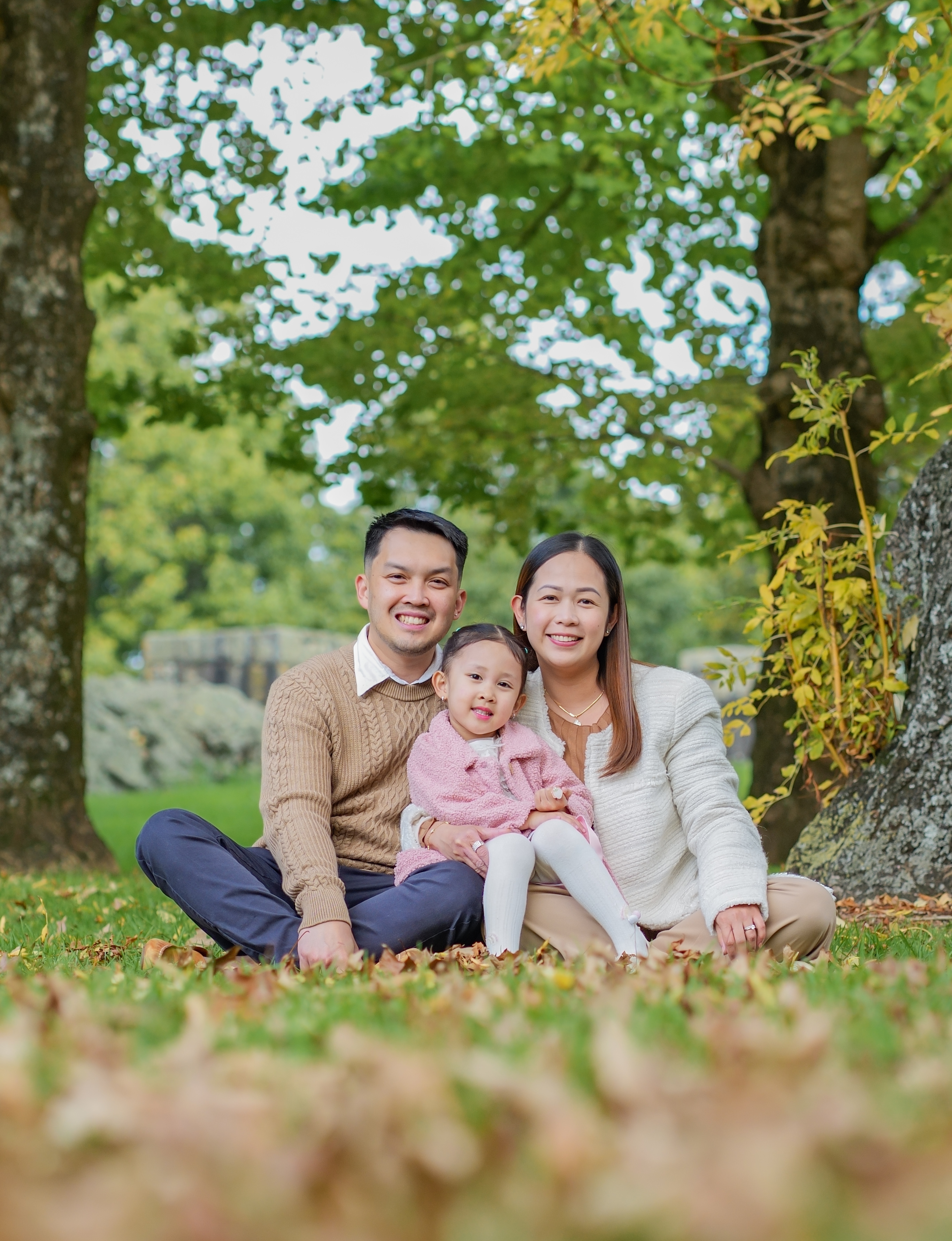 A family photographed outdoors in Auckland