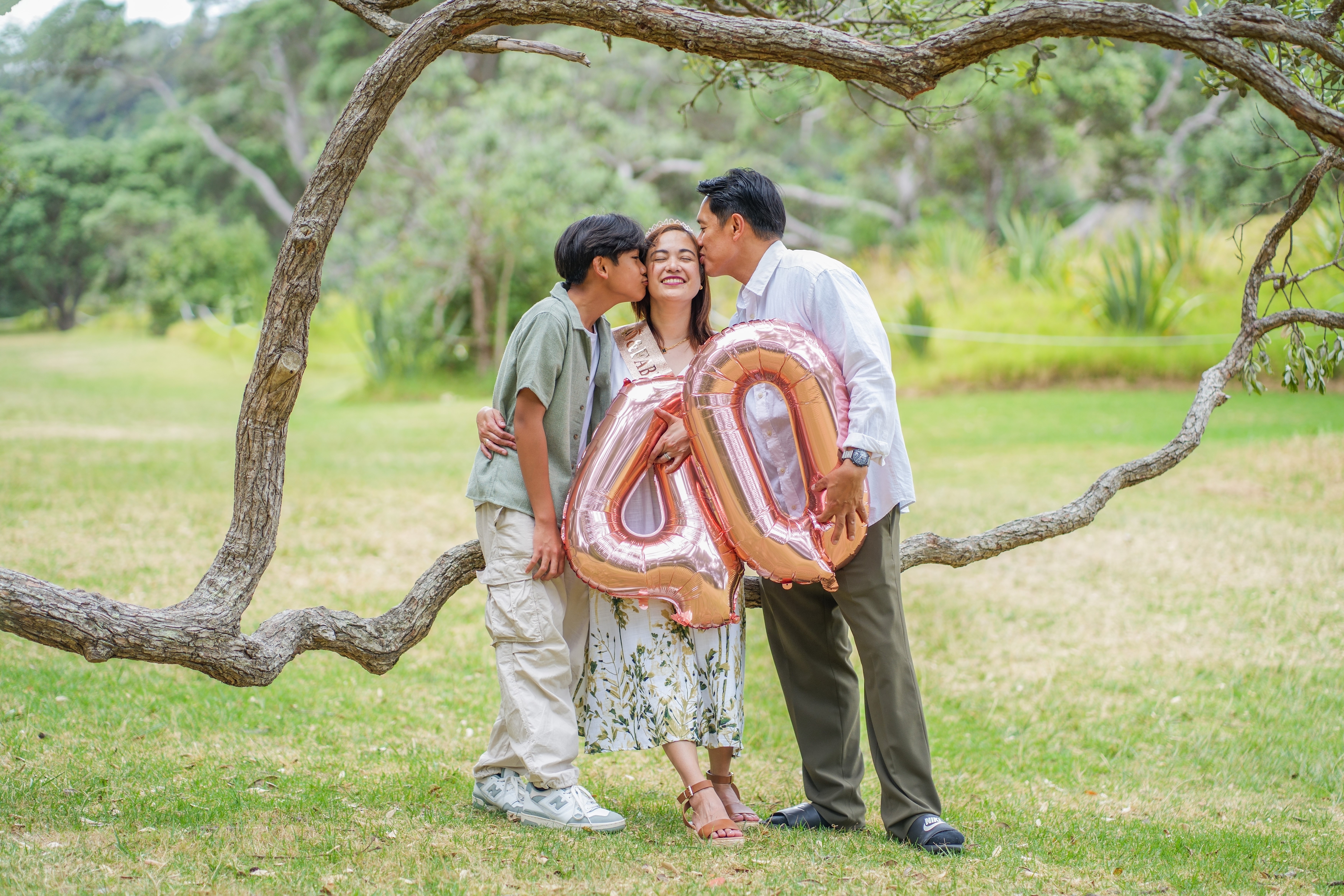 A family photographed outdoors in Auckland