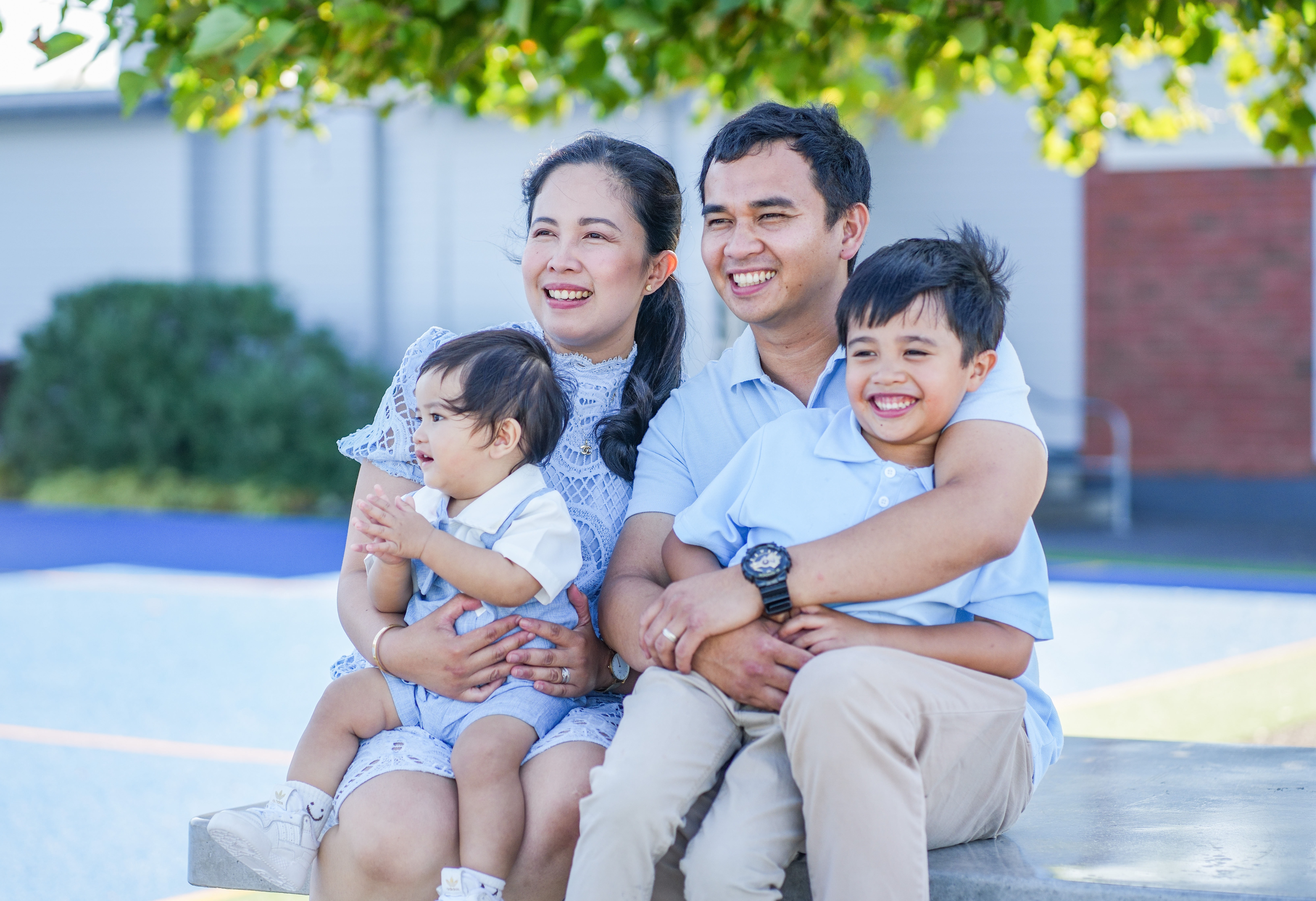 A family photographed outdoors in Auckland
