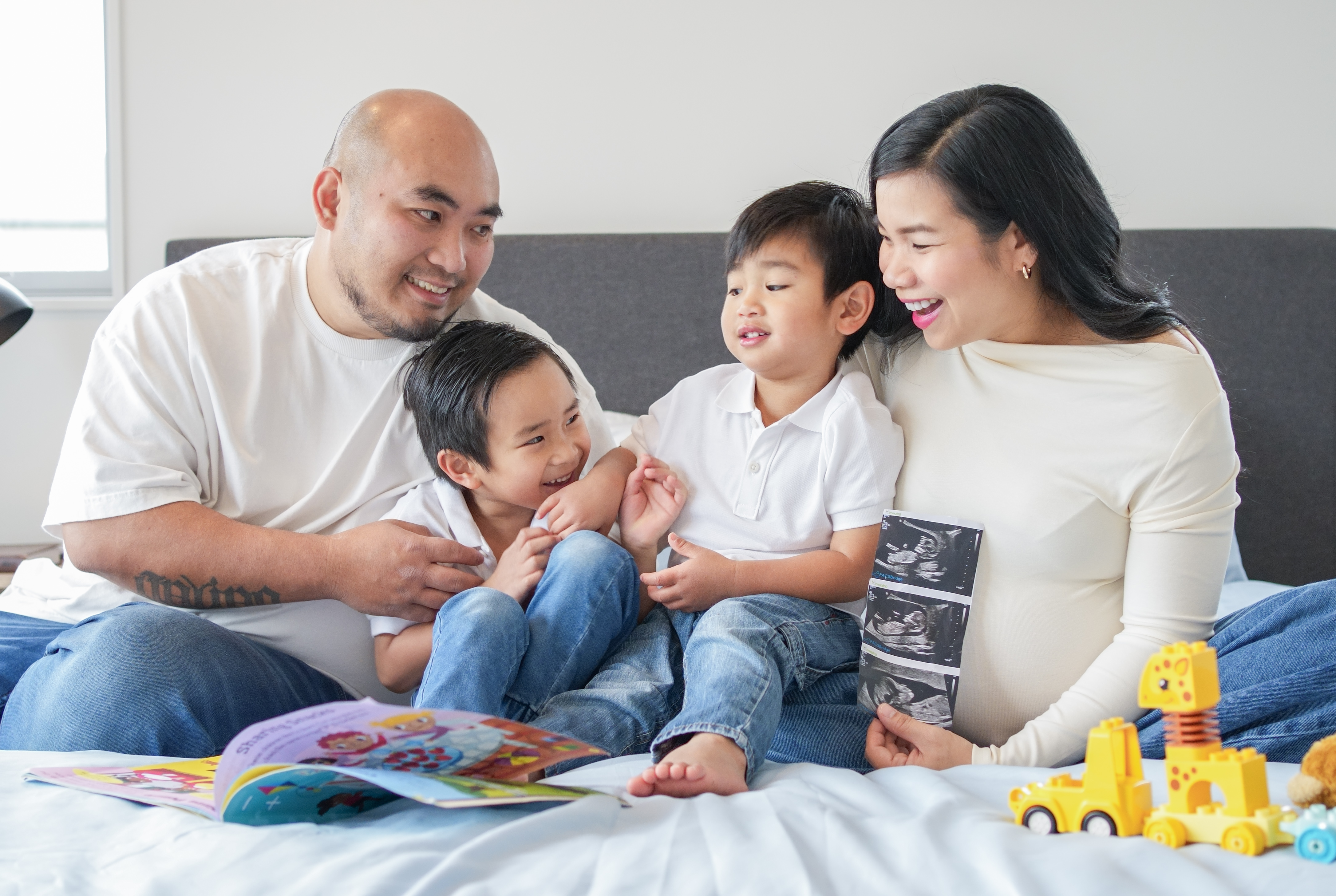 A family photographed outdoors in Auckland