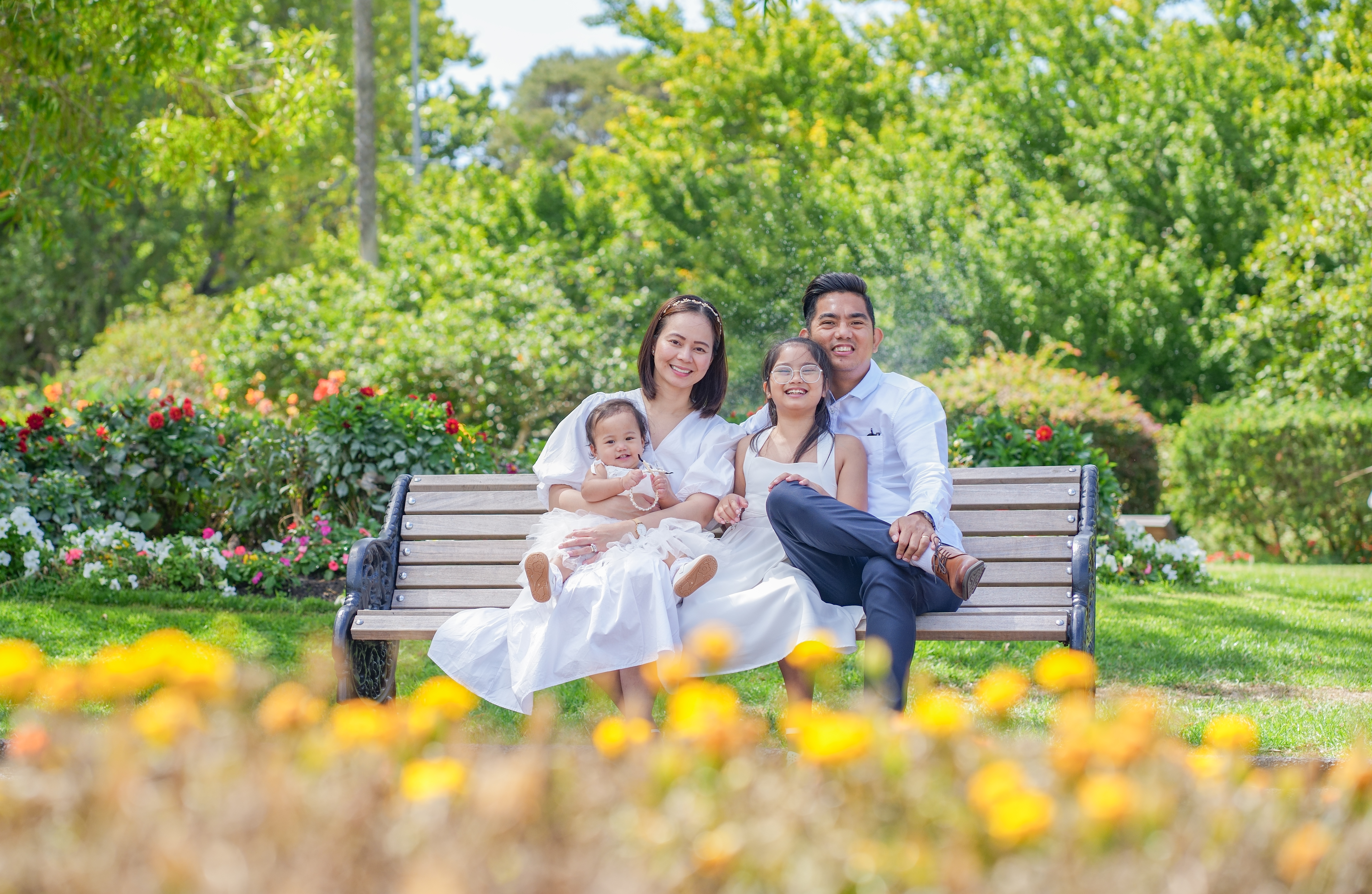 A family photographed outdoors in Auckland