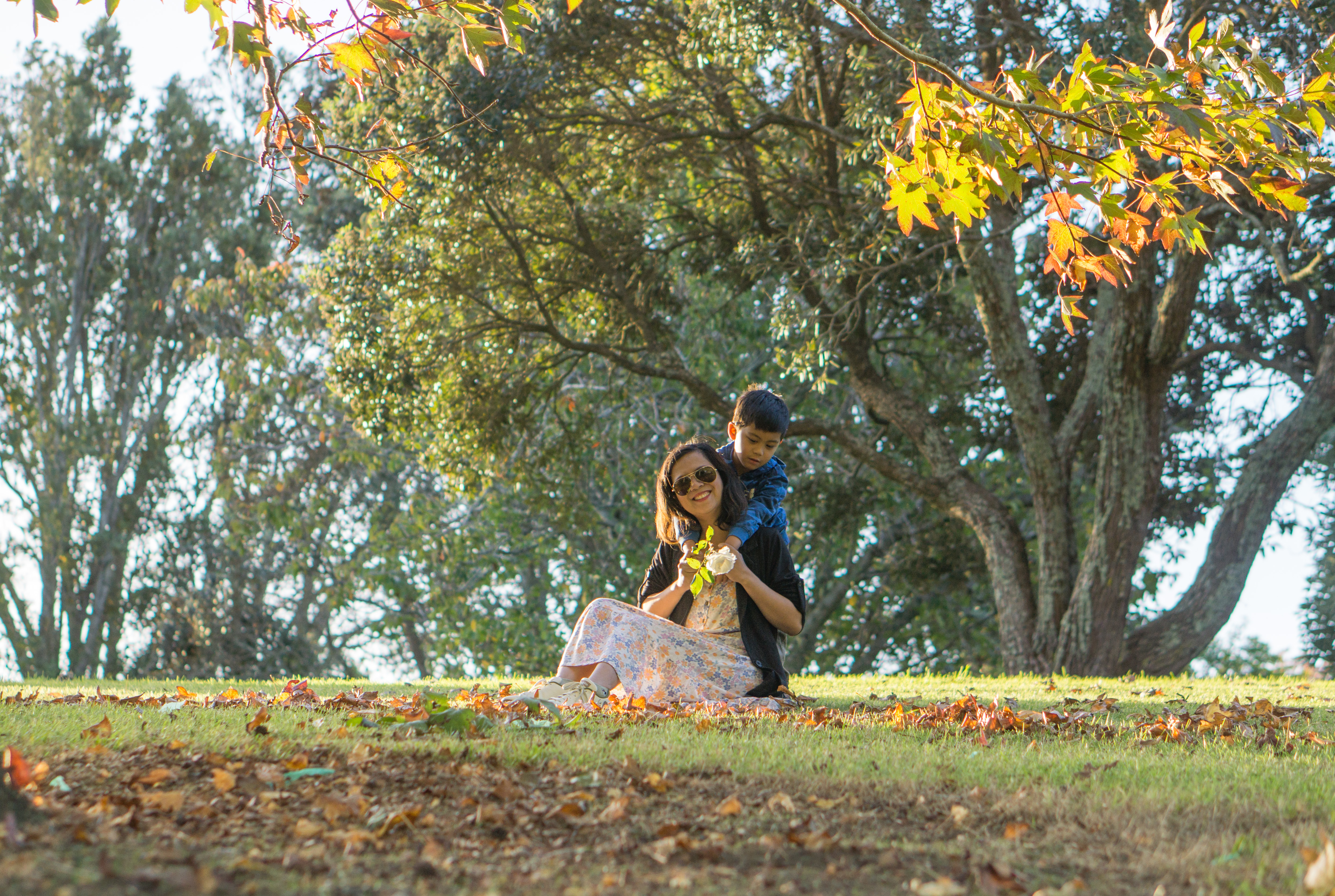 A family photographed outdoors in Auckland