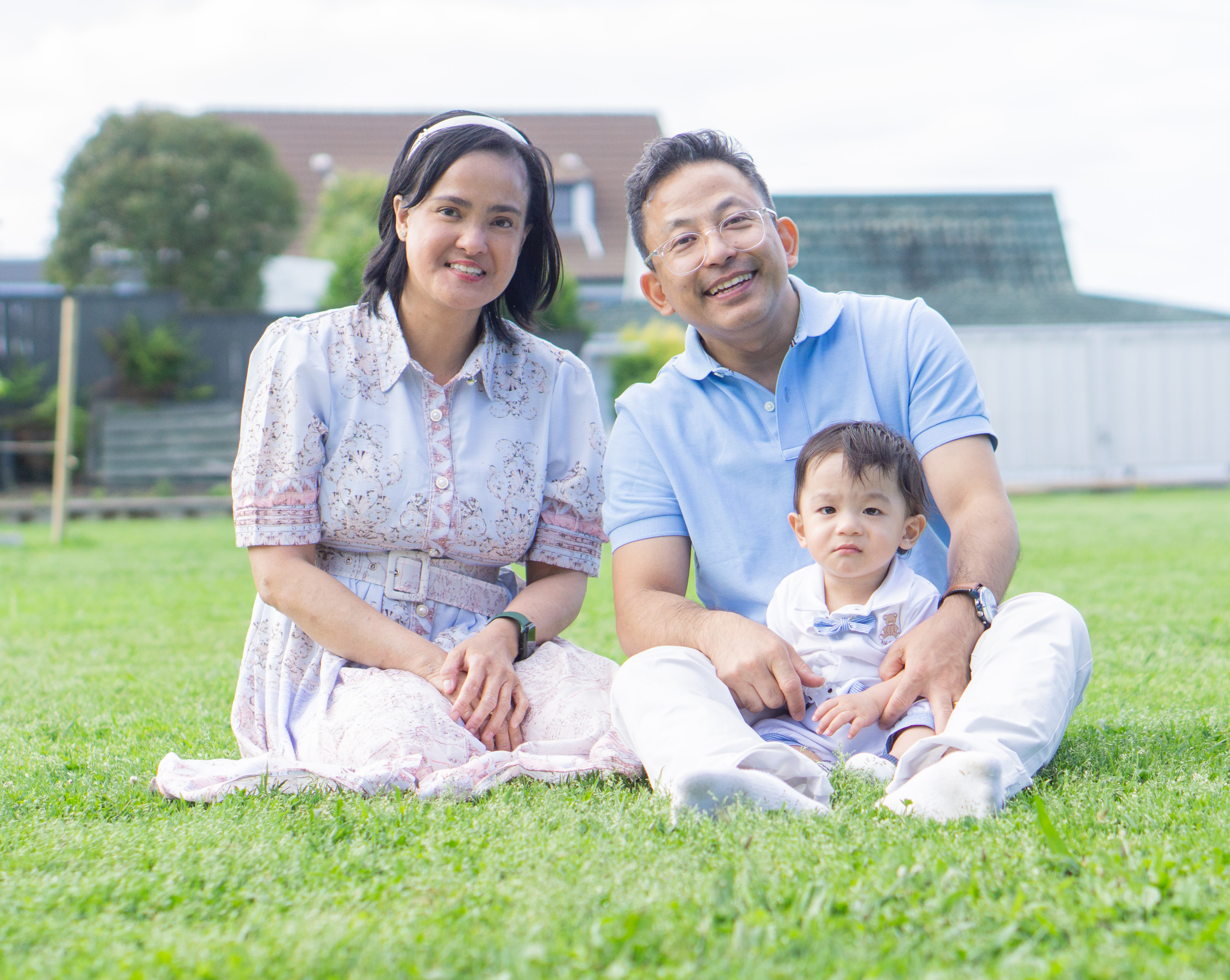 A family photographed outdoors in Auckland