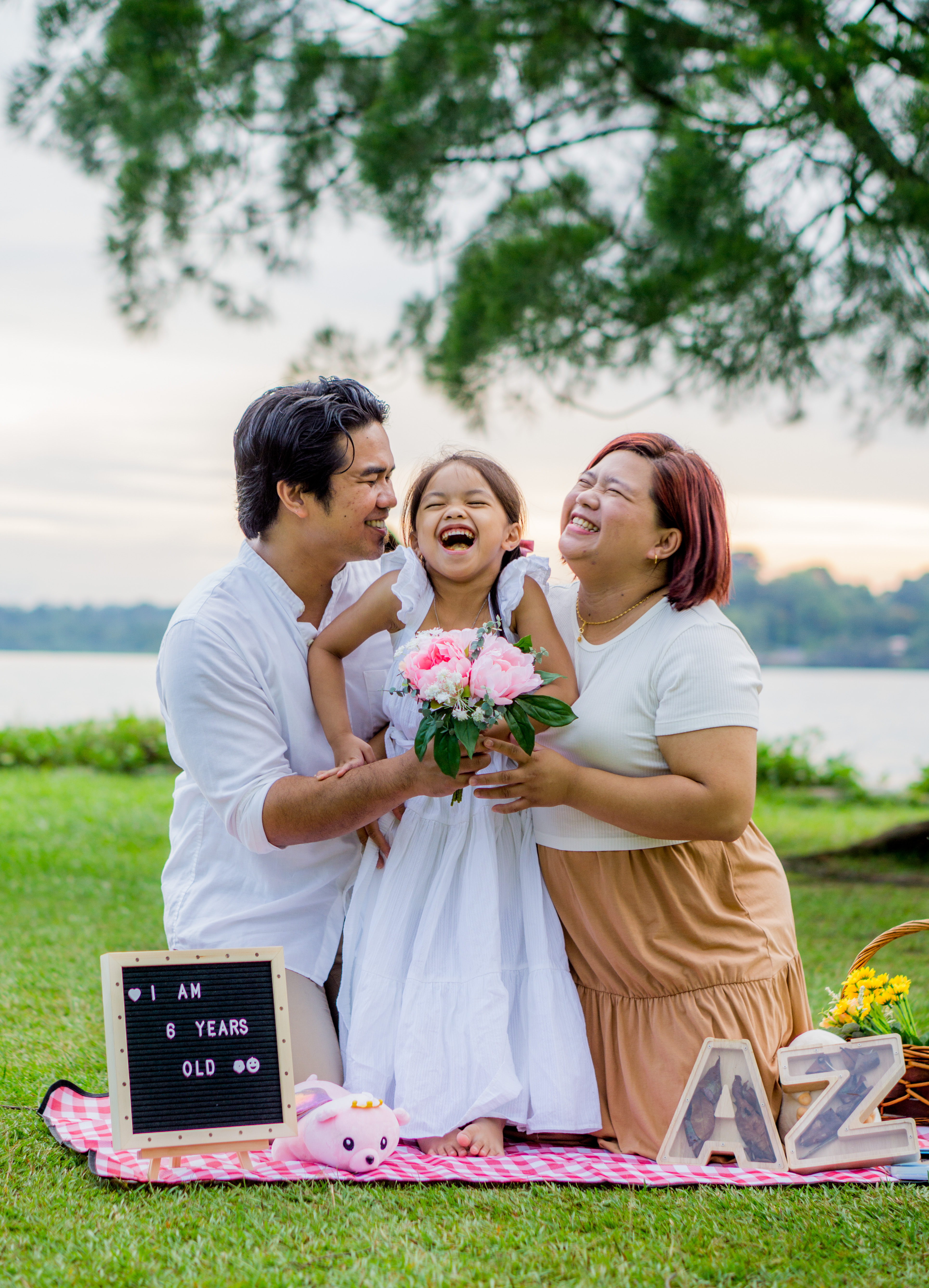 A family photographed outdoors in Auckland