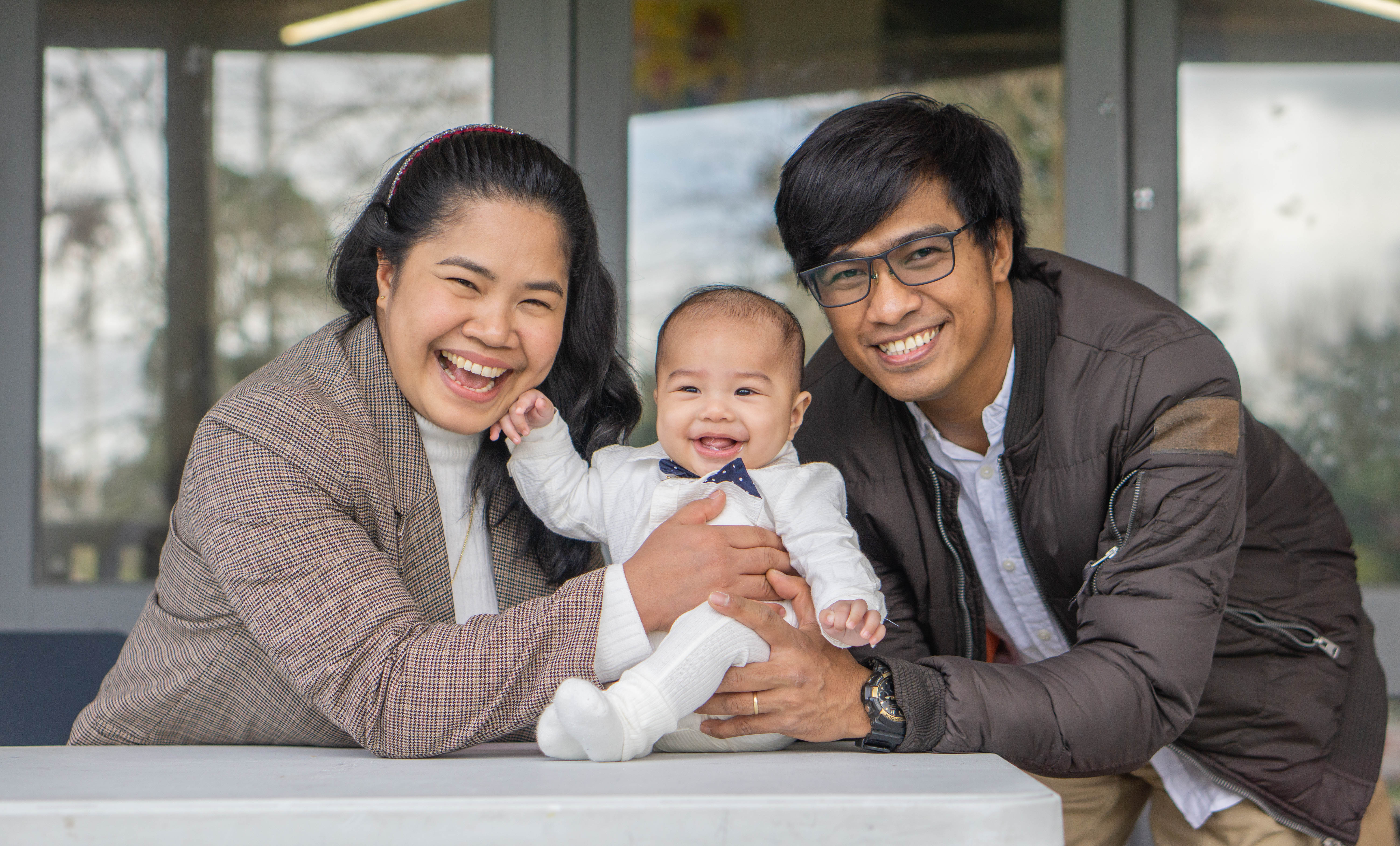 A family photographed outdoors in Auckland