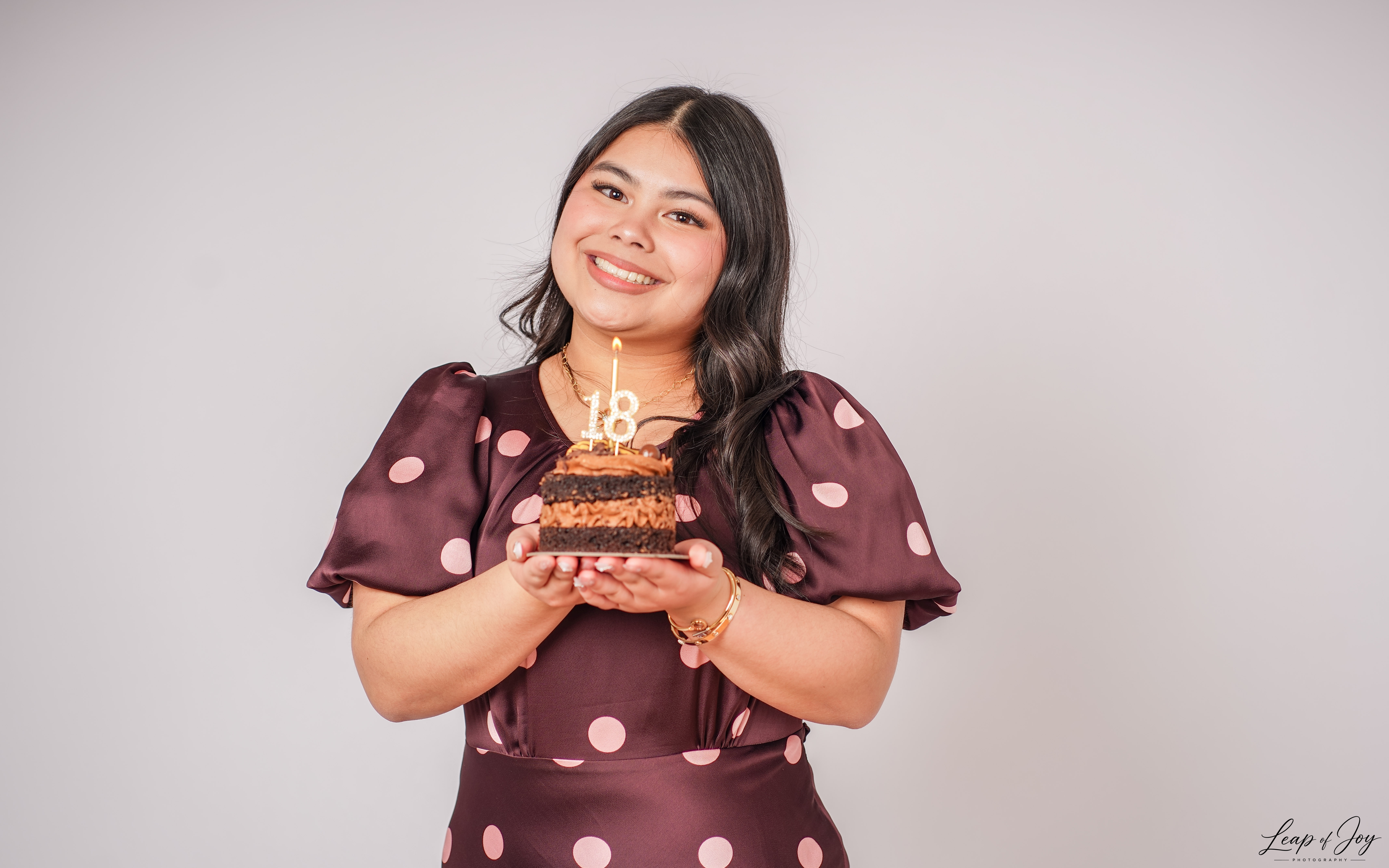 A debutante with her eighteenth birthday cake