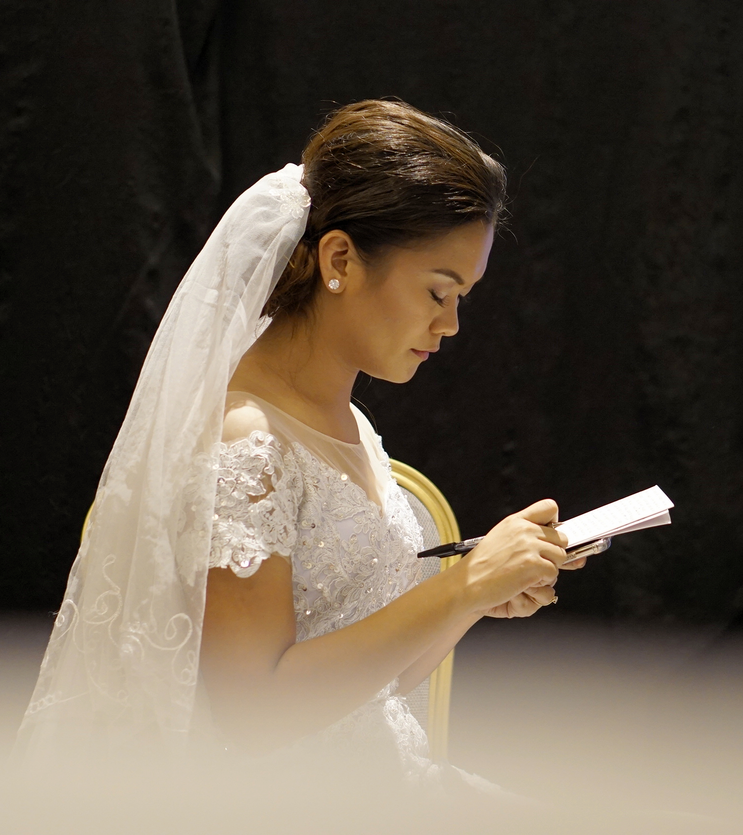 A bride with her vows before the ceremony