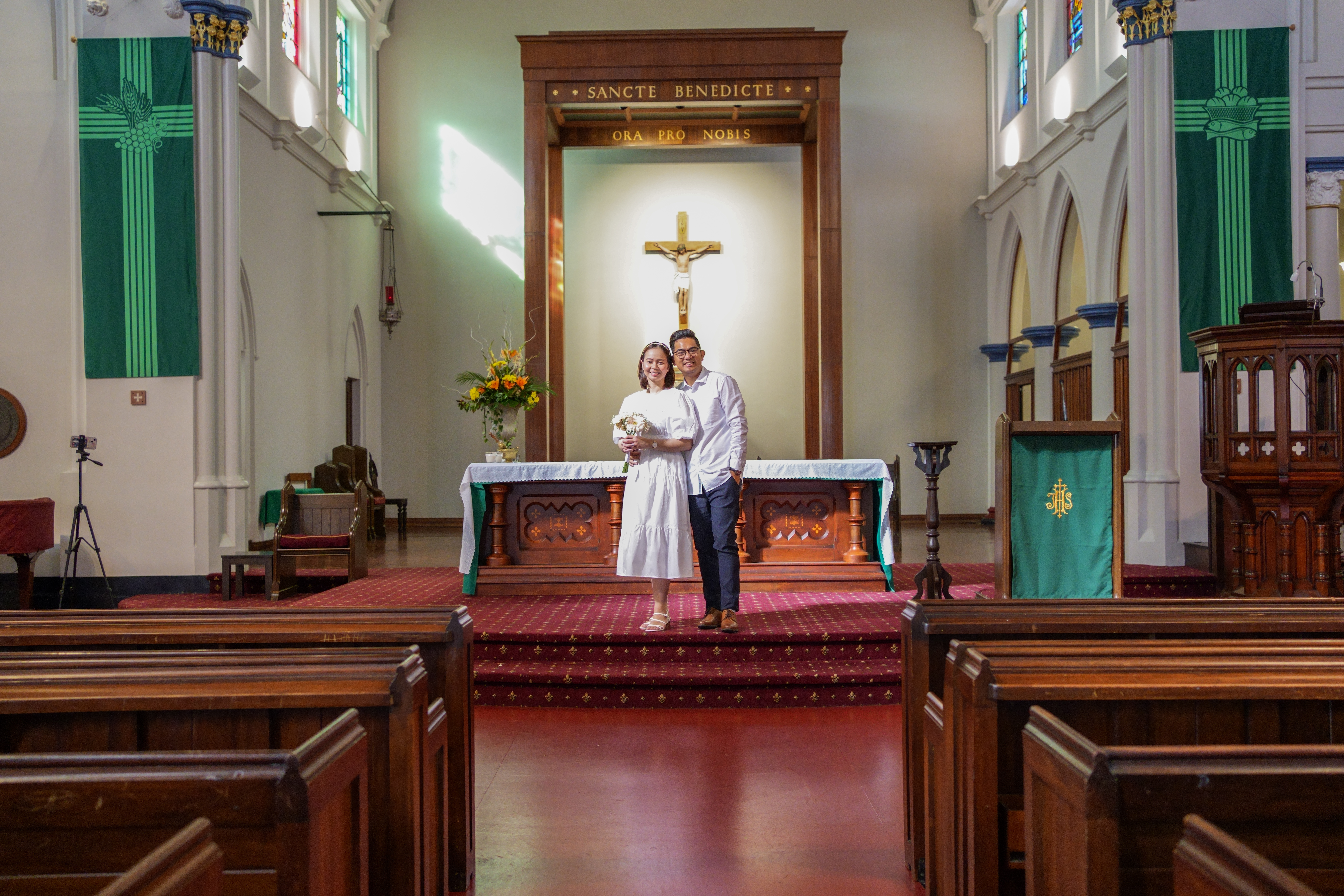 A couple at the altar of an empty church