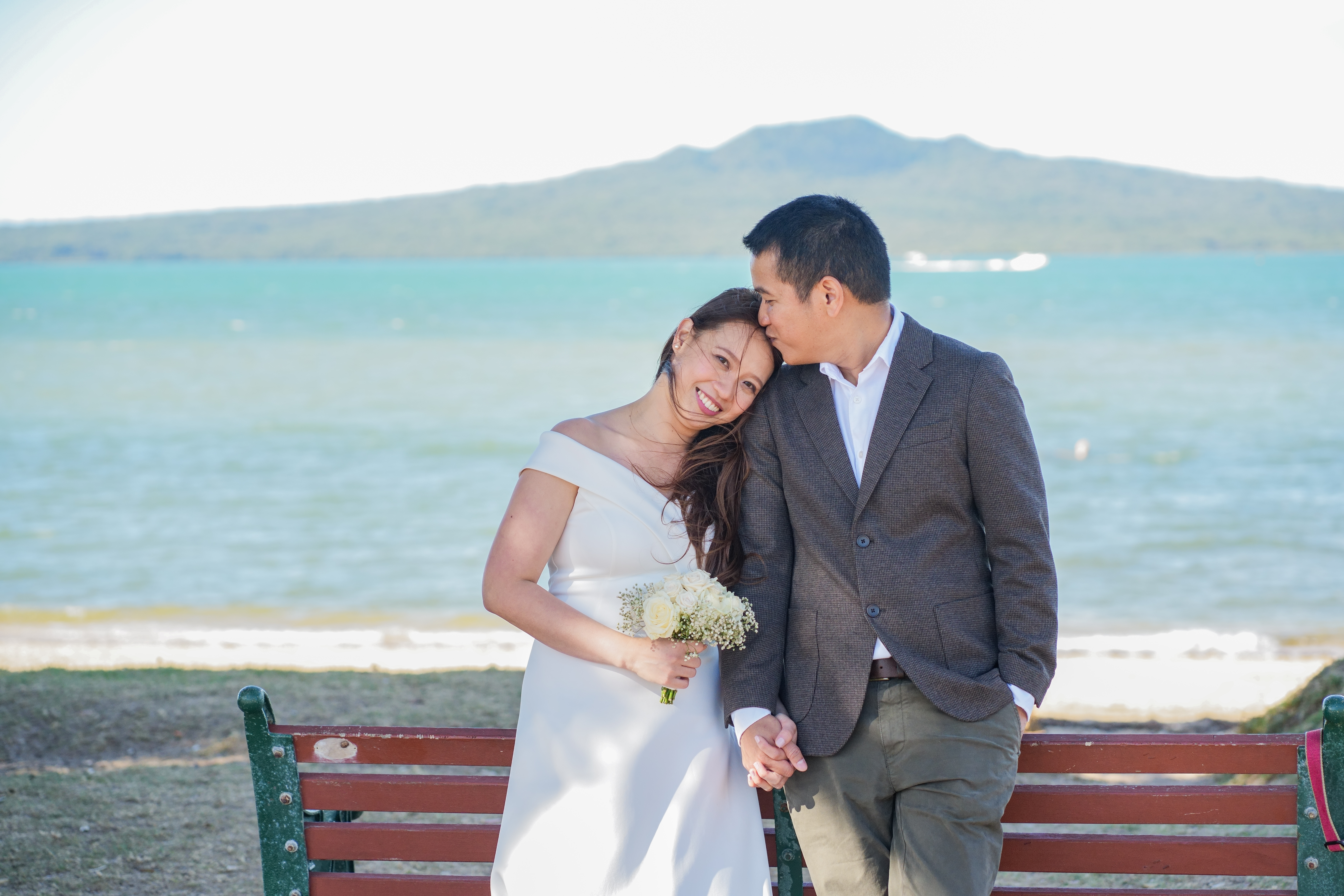 A newly married couple photographed on the waterfront