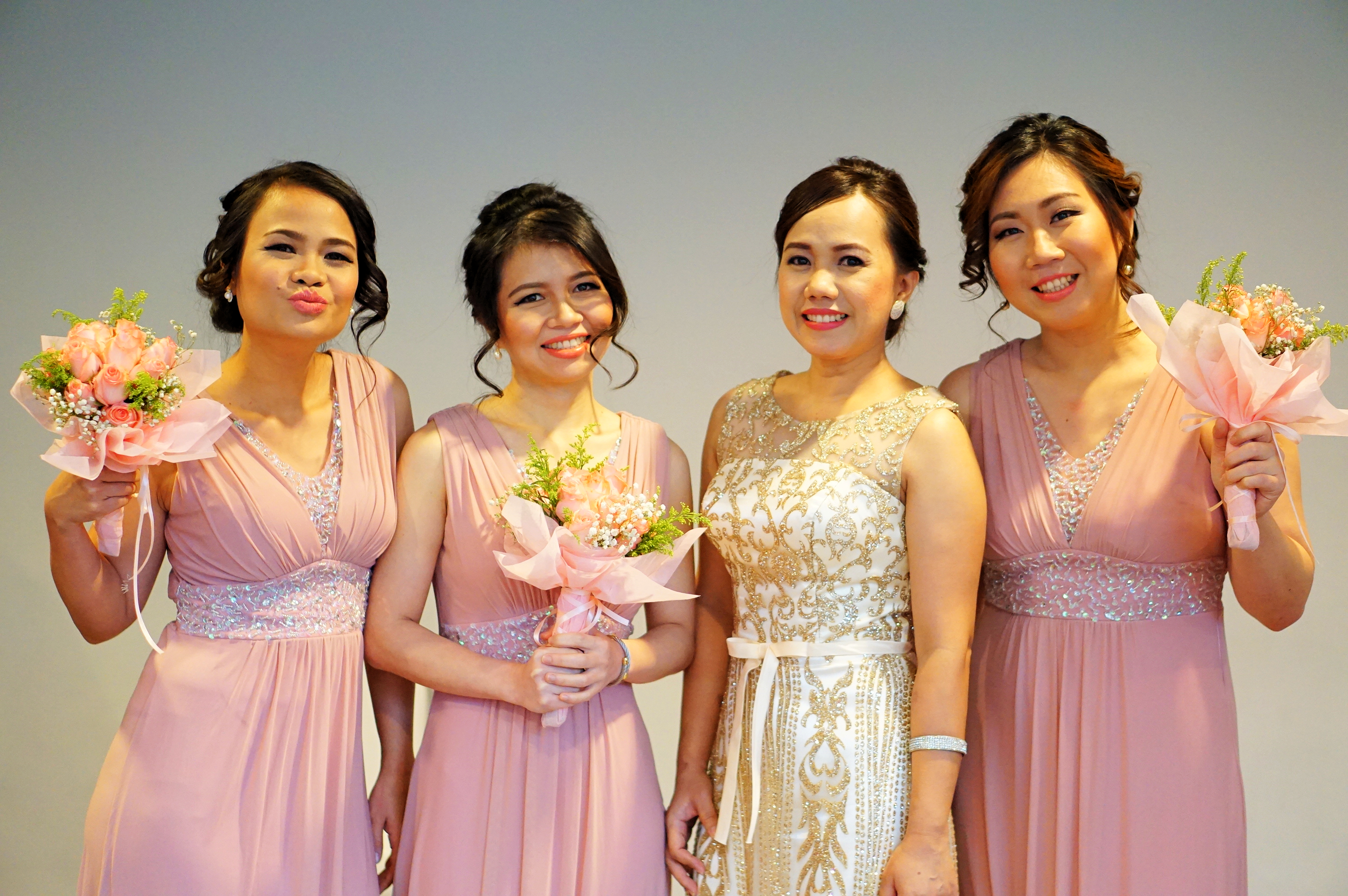 Bridesmaids photographed with their bouquets