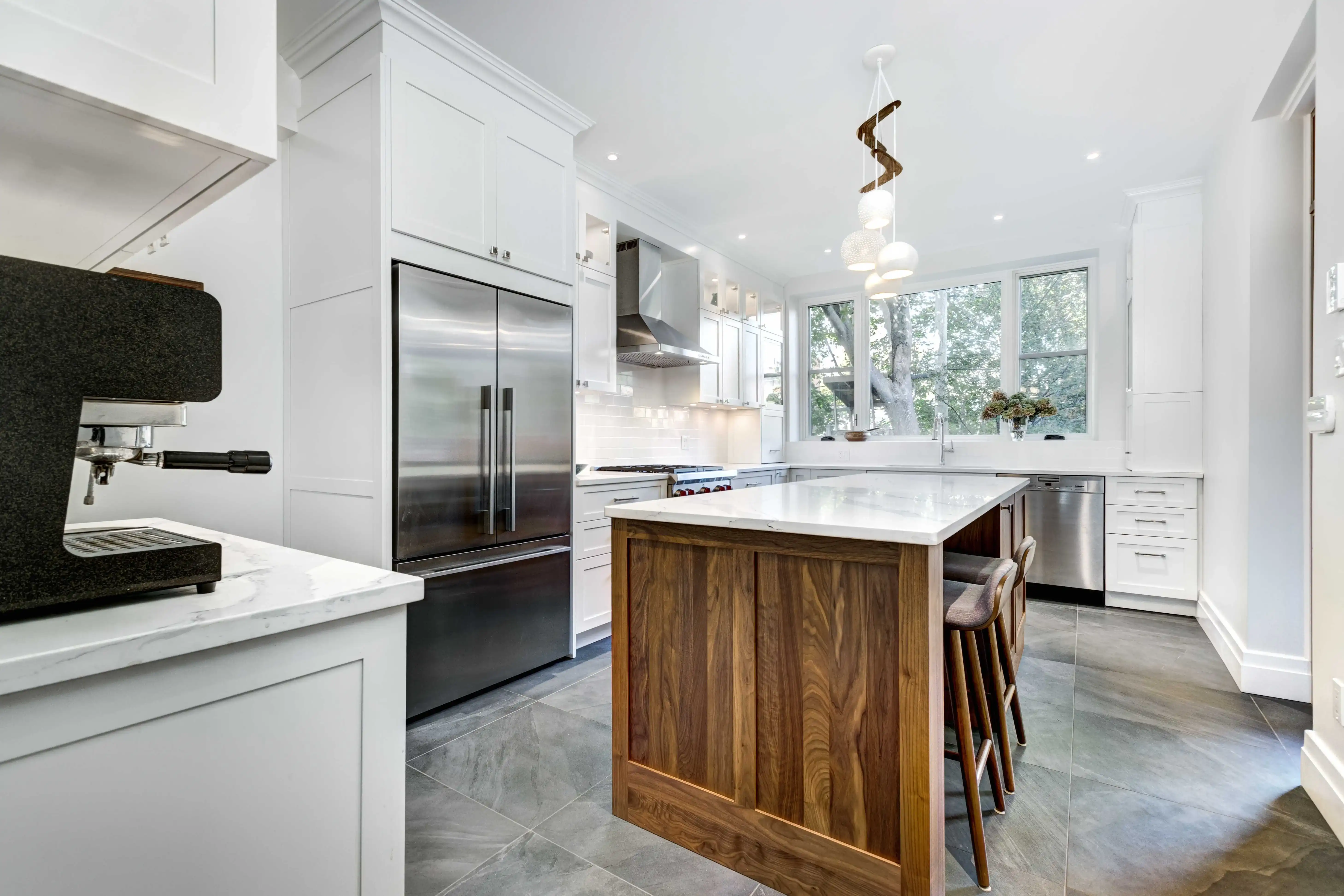 Luxury kitchen with statement island, warm tones, and high-end remodeling details