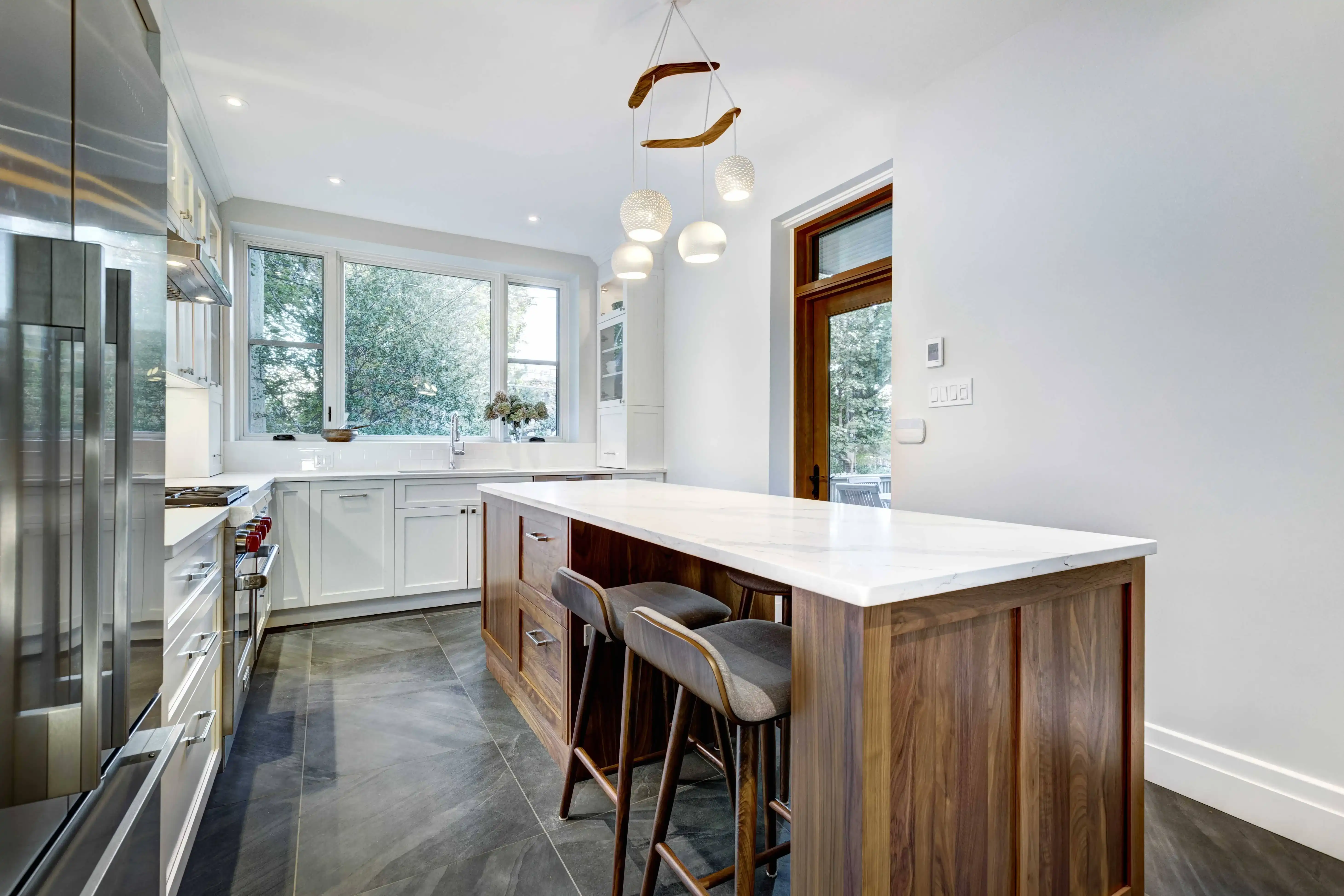 Kitchen remodel with refined cabinetry, clean surfaces, and polished finish details