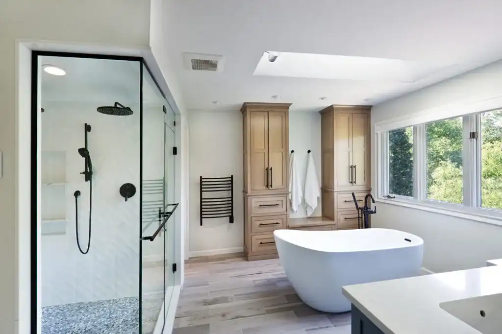Finished bathroom renovation with clean tile detail, polished fixtures, and a calm modern aesthetic