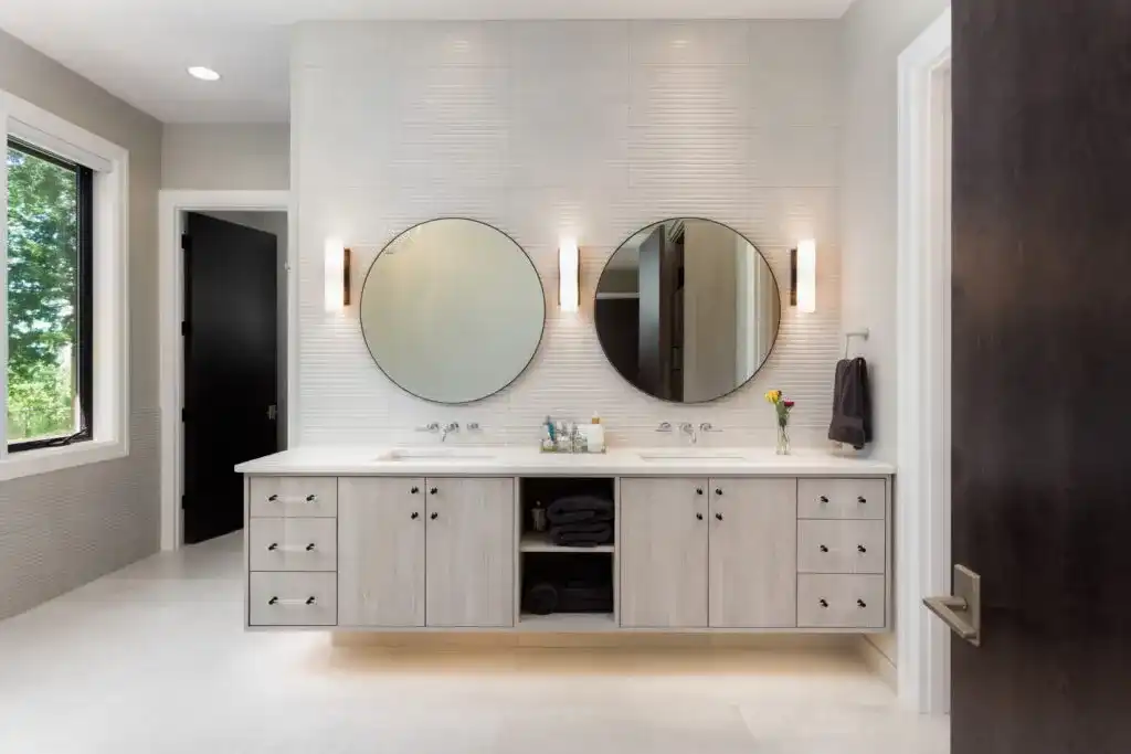 High-end bathroom remodel with premium vanity, large tile floor, and refined fixture selection