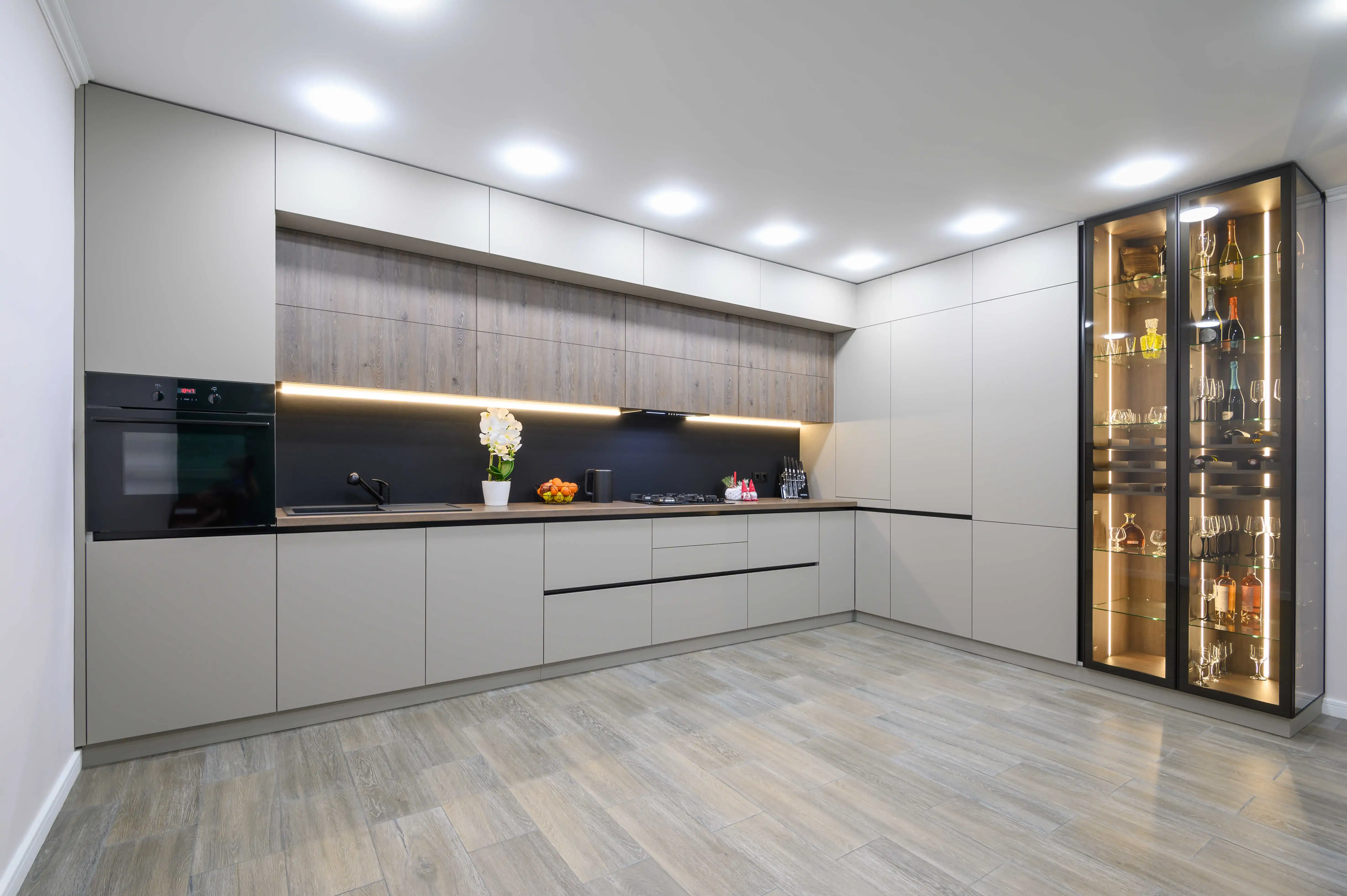 High-end millwork and built-in shelving by B&Y Reno Corp — warm wood finish, seamless install