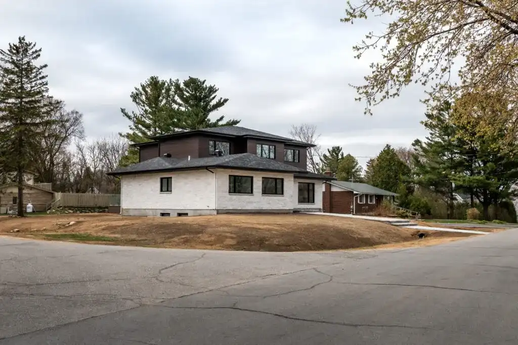 Wide front exterior shot of the Forestview Modern Estate