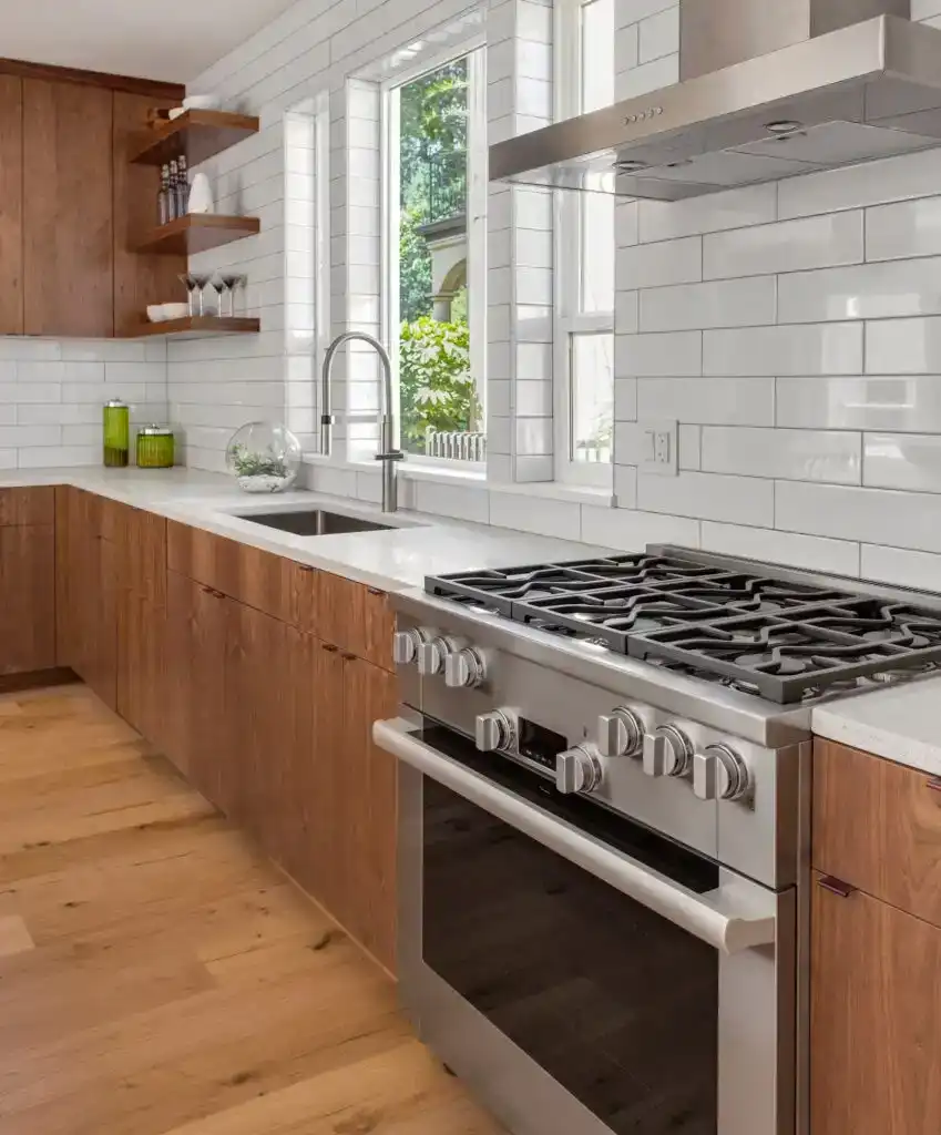 Wide view of the modern walnut kitchen with clean layout and open flow