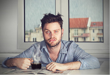 Tired single father drinking coffee while balancing work, parenting, and dating Tired single father drinking coffee while balancing work, parenting, and dating