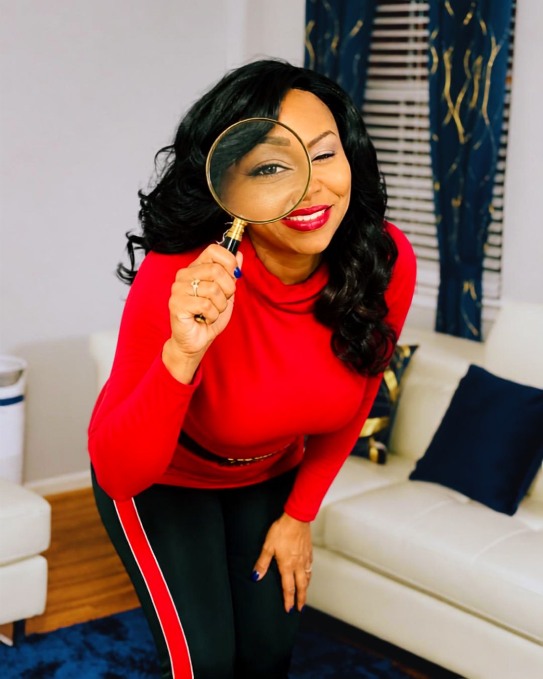 Tracie Davis holding a magnifying glass