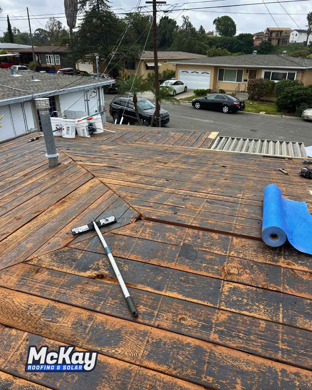 Roof tear-off in progress after removing the existing shingles.