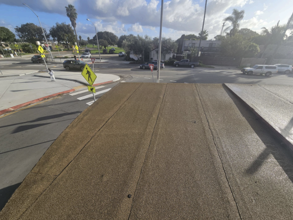 Old flat roof with worn seams before replacement Ocean Beach San Diego