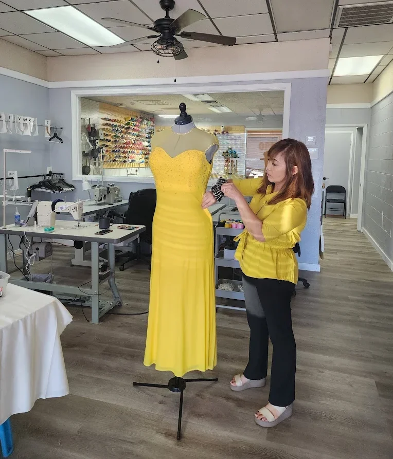 Pon working on dress alterations in Redding CA