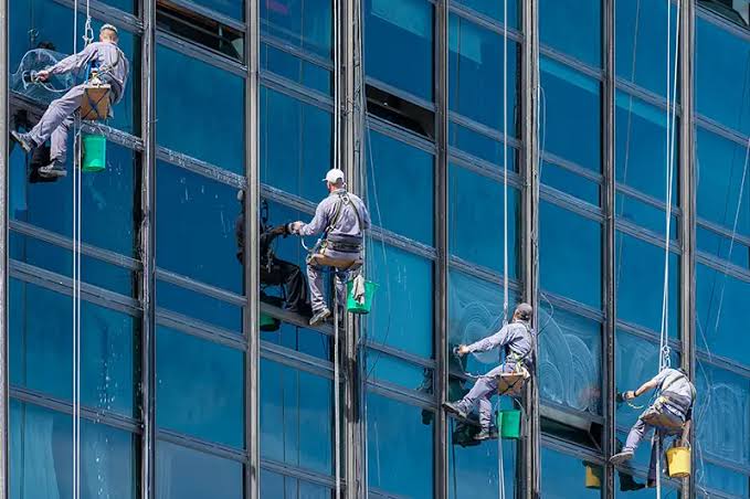 Clean glass facade of a commercial building, commercial window cleaning, Lindale TX