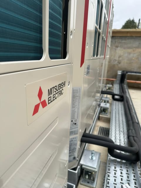 Daikin air to air heat pump indoor unit installed in a modern living room