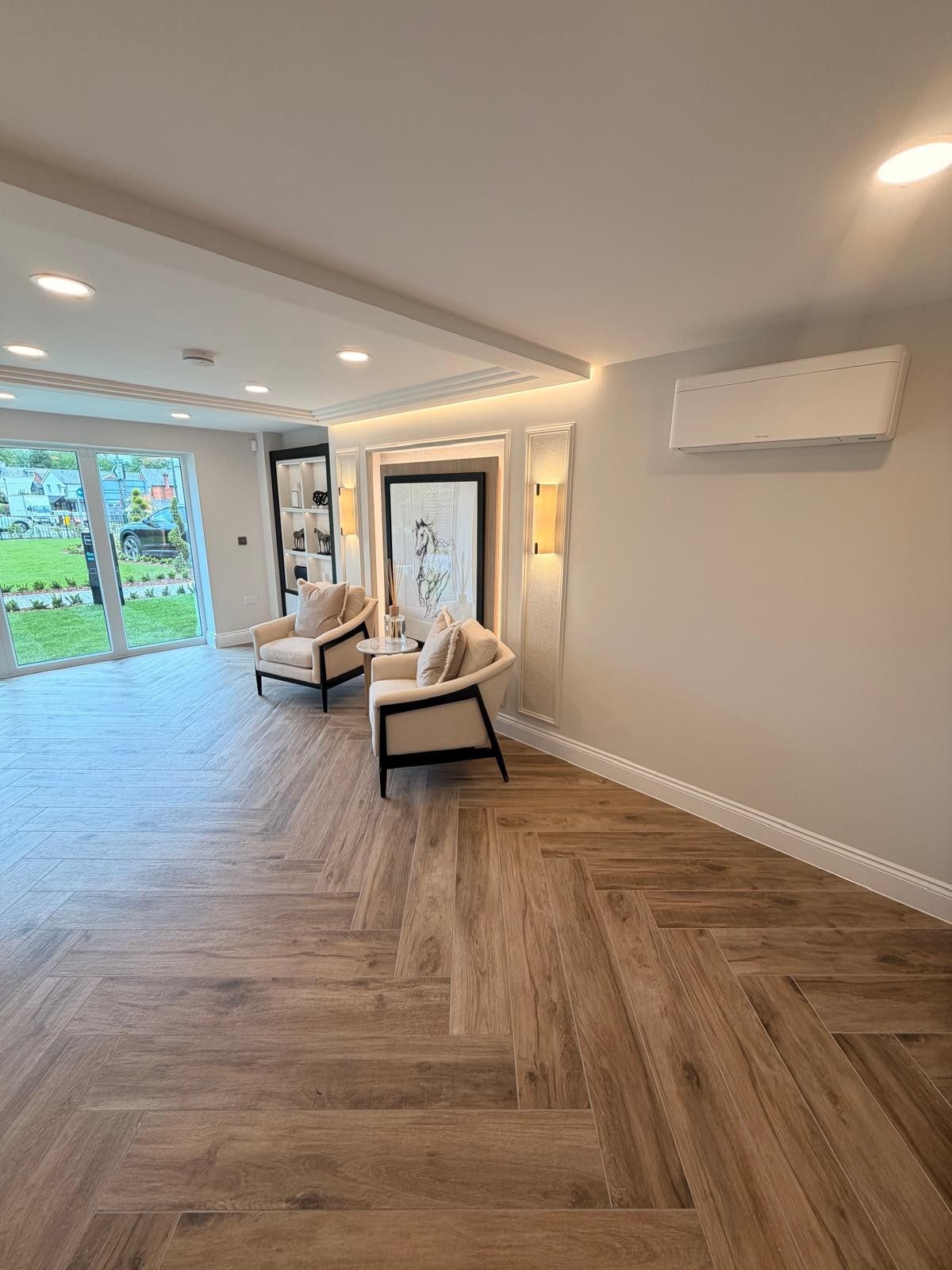 Wall-mounted air conditioning unit in a bright living room