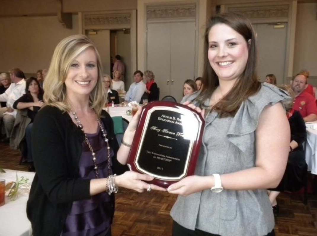 Mary Harmon Young receiving the Arthur B. Pope Education Award from the Tuscaloosa Association of REALTORS
