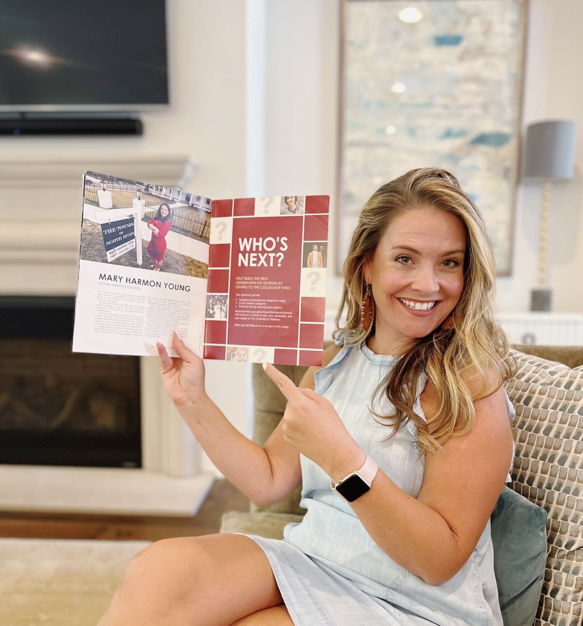 Mary Harmon Young holding the University of Alabama College of Arts and Sciences magazine open to her full-page feature