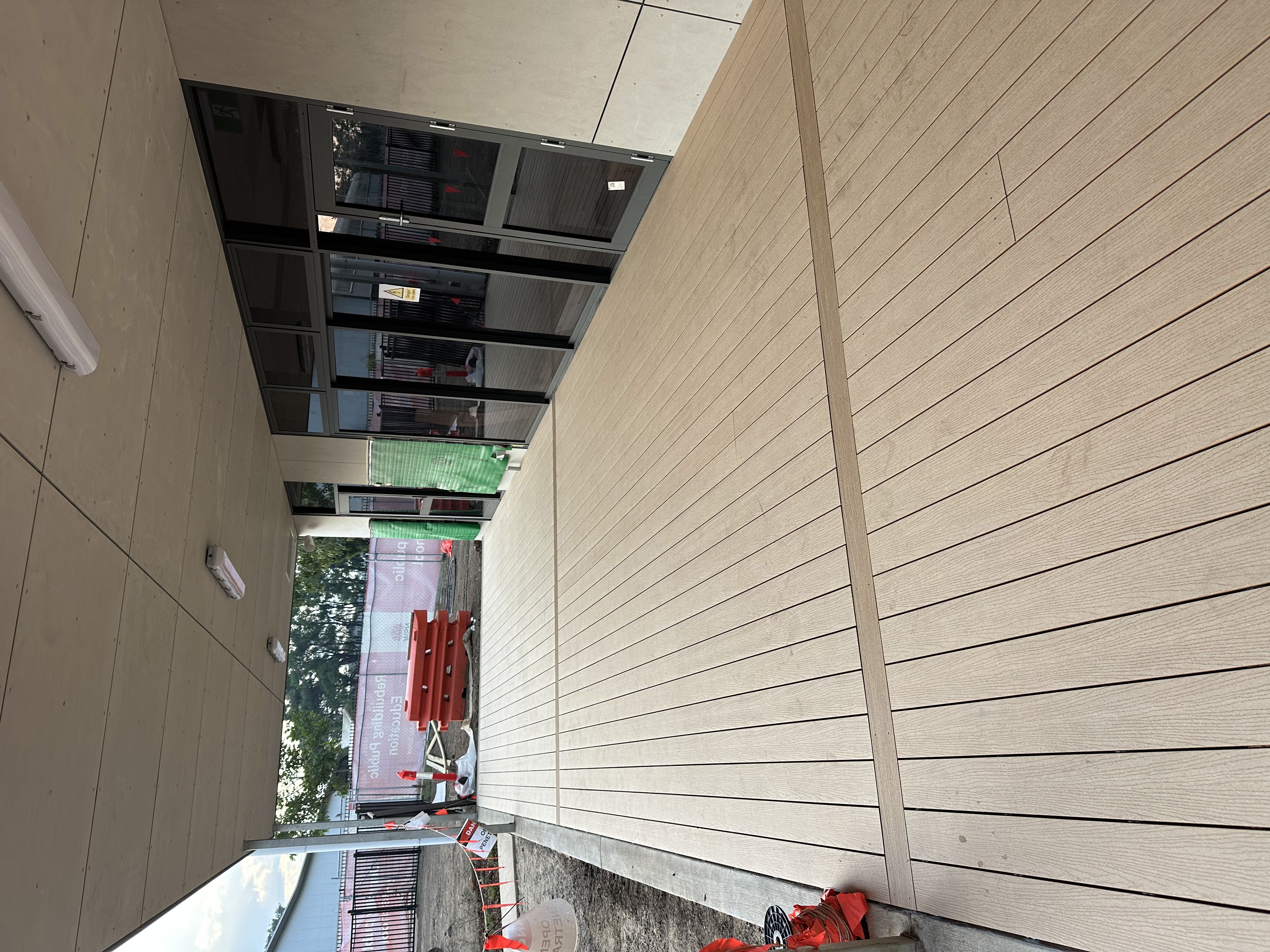Finished composite decking under a commercial awning