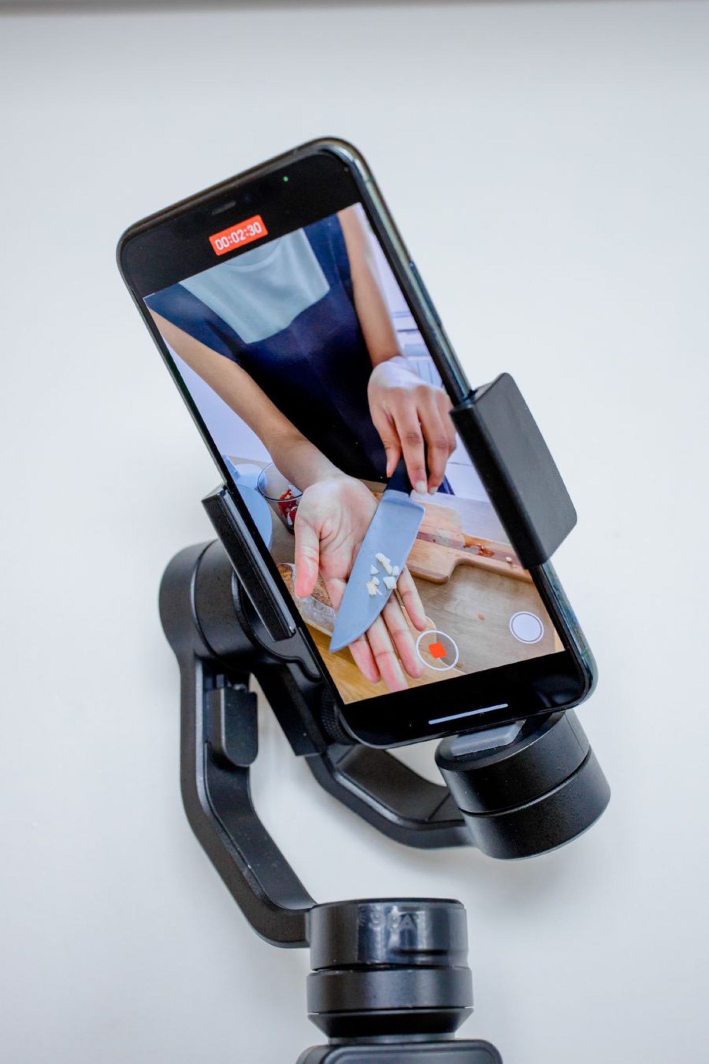 A smartphone on a gimbal recording video — illustrative stock photo