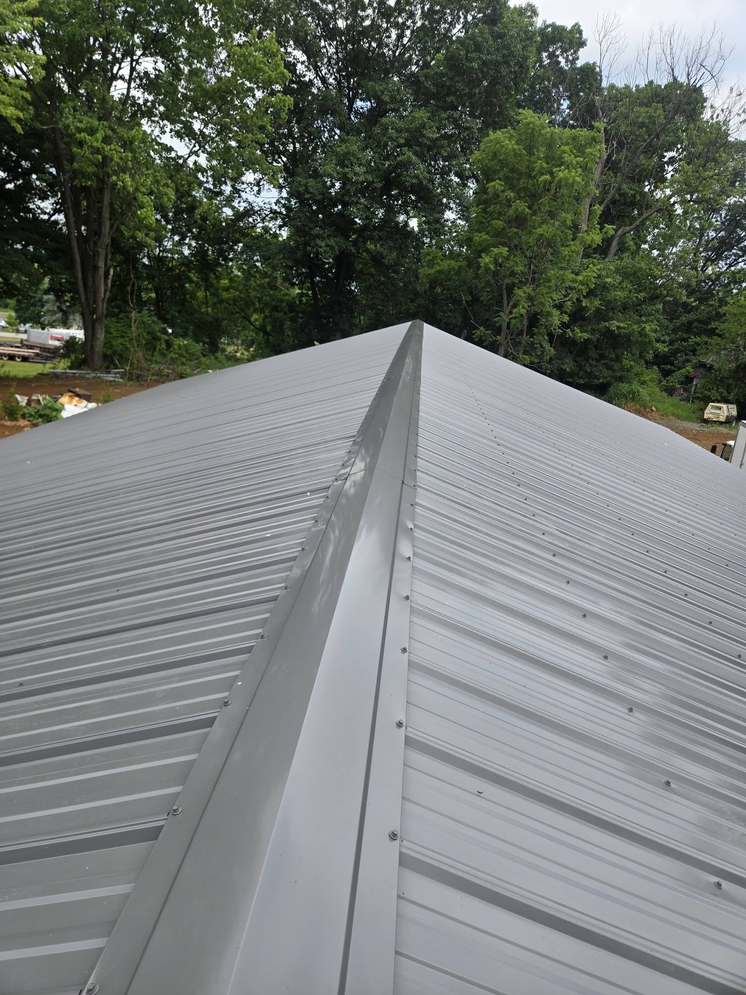 Close detail of a metal roof ridge installed by Harcon Services