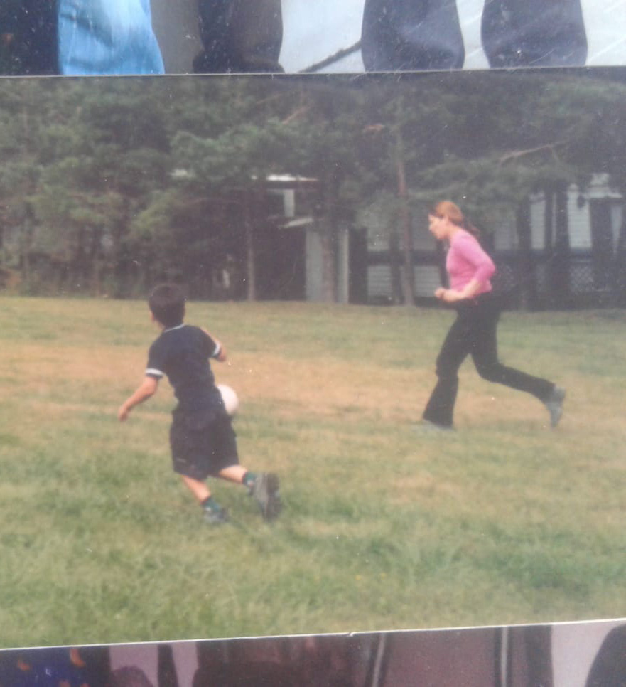 Derick playing with his mom at 7 years old