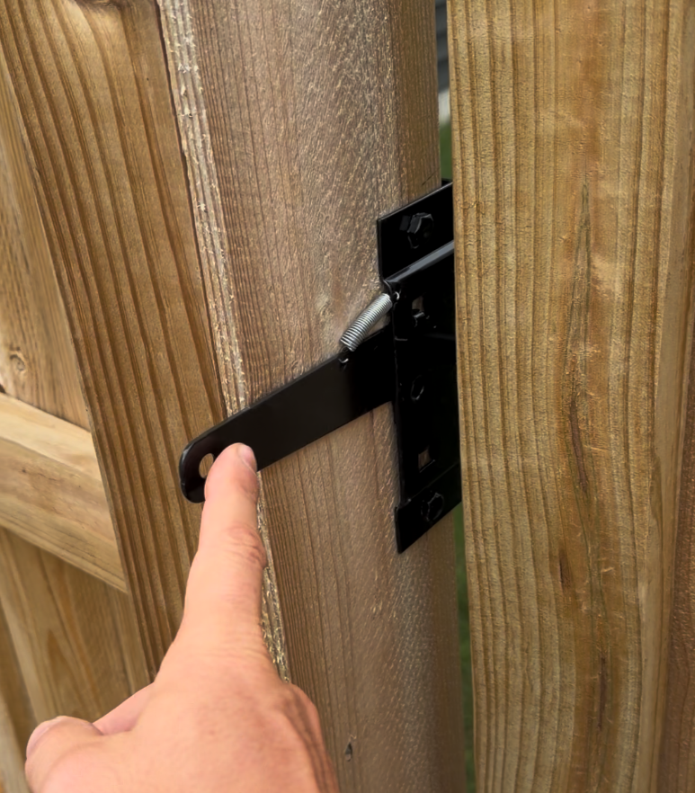 Double drive gate on a pressure-treated pine privacy fence