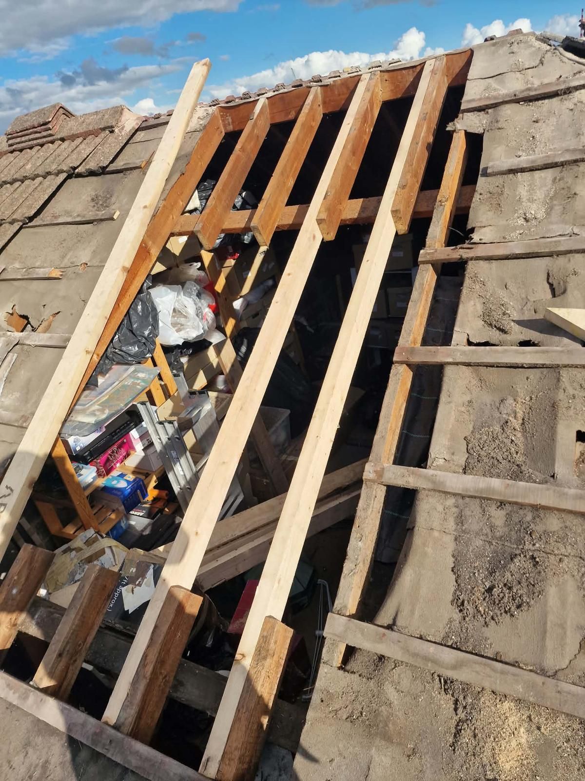 New roof timbers beside old roofing felt and battens on a Ballsbridge, Dublin 4 roof