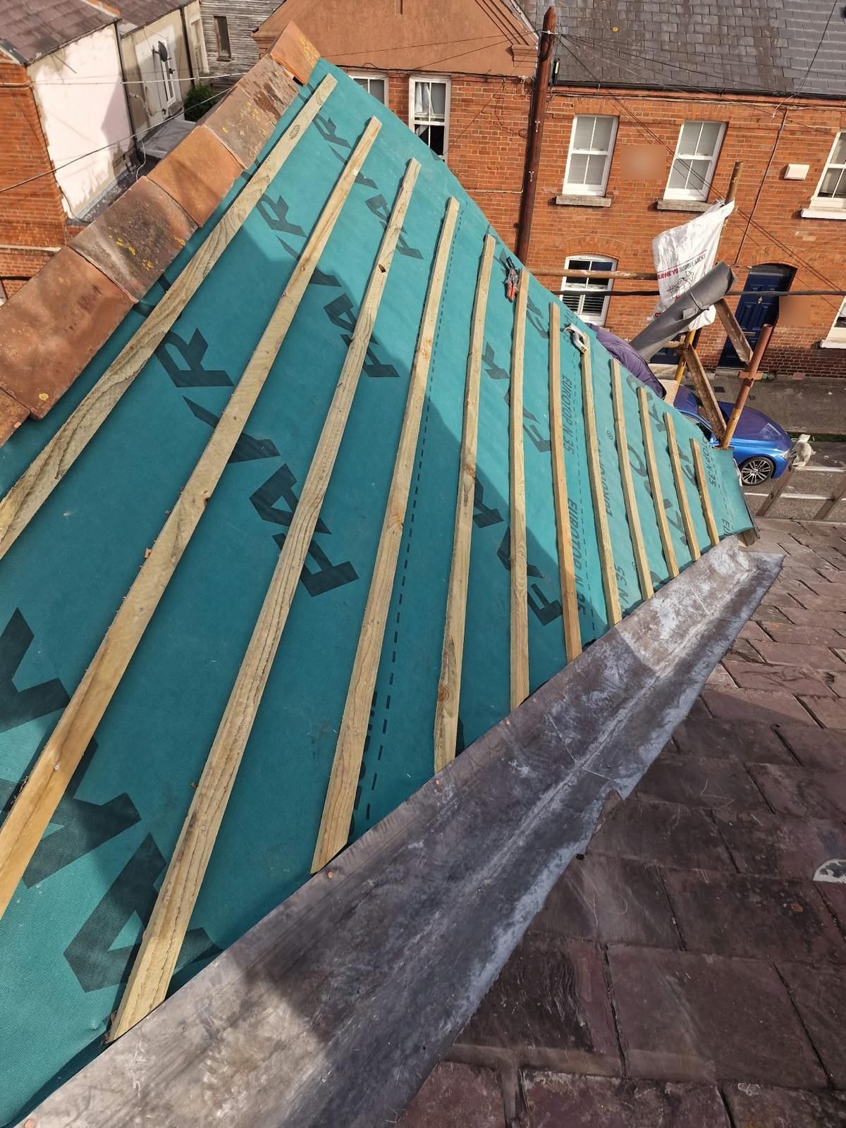 New Fakro breathable membrane and timber battens on a roof slope above a terraced street in Portobello, Dublin 8