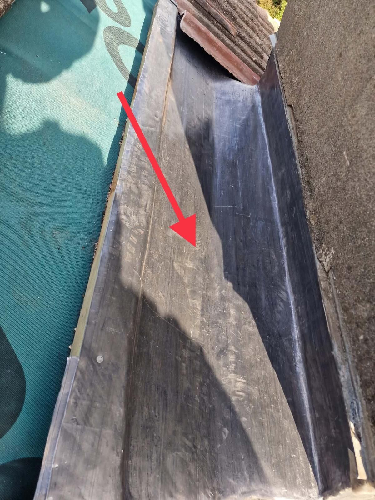 New lead-lined gutter beside a rendered chimney, before the tiles go back, in Ballsbridge, Dublin 4