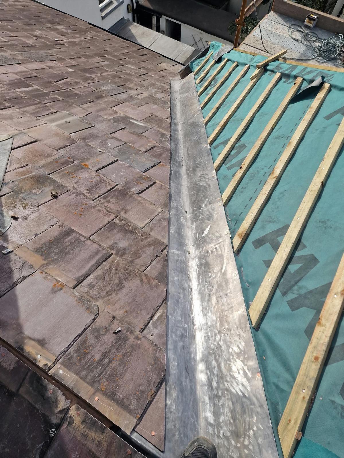 New lead valley between a re-felted roof slope and a natural slate roof in Portobello, Dublin 8